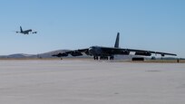 A B-52H Stratofortress lands at Fairchild Air Force Base, Washington during an Agile Combat Employment exercise Aug. 16, 2022. Using the ACE concept, within a few hours B-52s can land at a non-bomber location, receive repairs, resupply and be back in the air before an adversary can pinpoint their location. (U.S. Air Force photo by Senior Airman Chase Sullivan)