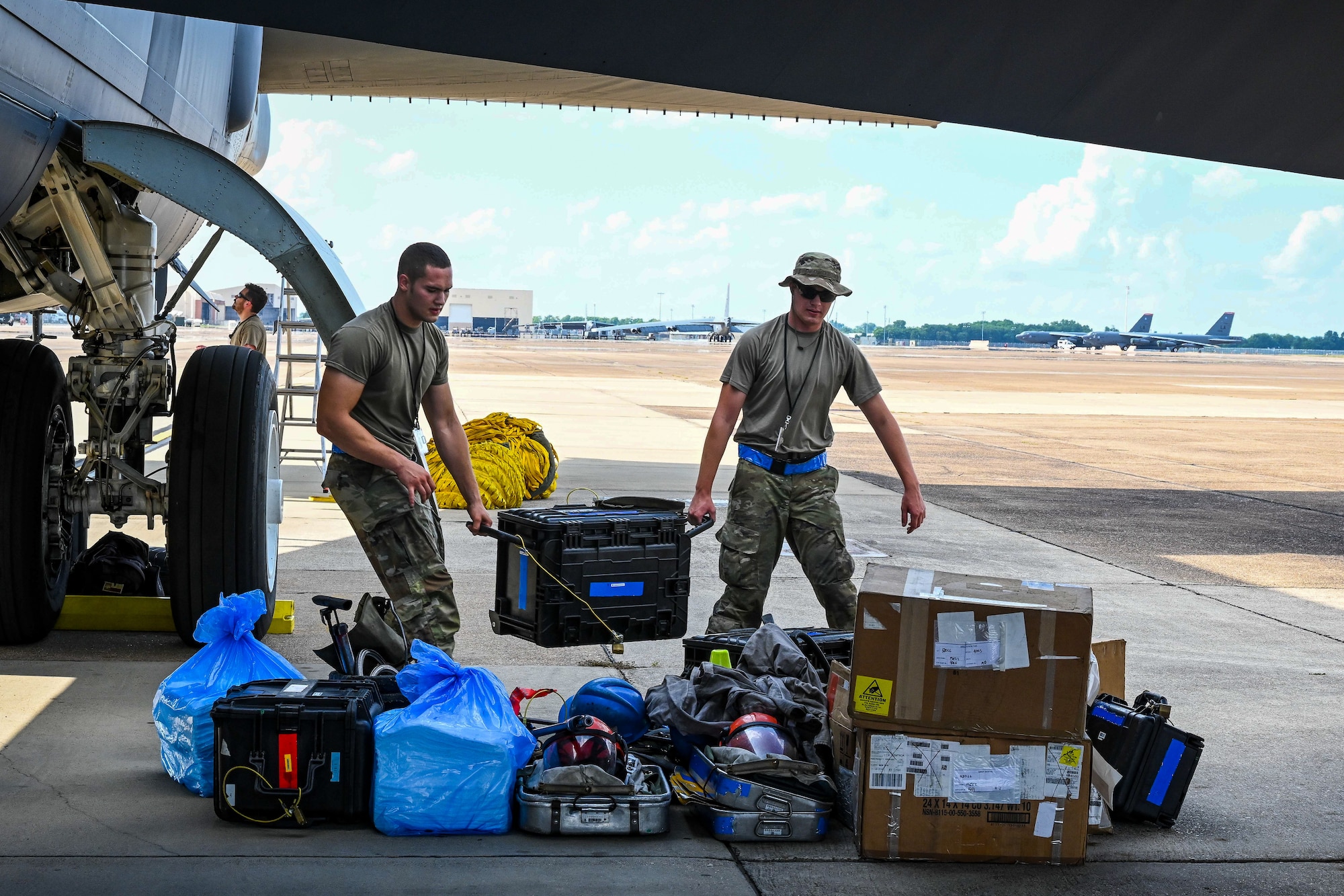 Airmen from the 2nd Aircraft Maintenance Squadron unload maintenance and support equipment from a B-52 On-board Cargo System after a Agile Combat Employment exercise at Barksdale Air Force Base, Louisiana, Aug. 19, 2022. The maintainers packed, loaded and unloaded the BOCS to practice the self-sustained logistics capabilities that forge successful aircraft regeneration at contingency locations. (U.S. Air Force photo by Airman Nicole Ledbetter)