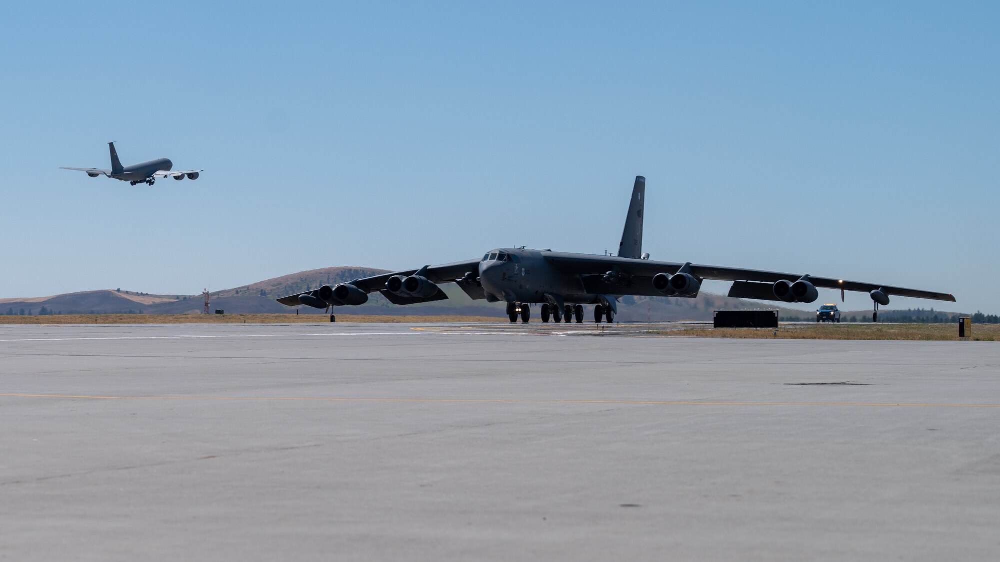 A B-52H Stratofortress lands at Fairchild Air Force Base, Washington during an Agile Combat Employment exercise Aug. 16, 2022. Using the ACE concept, within a few hours B-52s can land at a non-bomber location, receive repairs, resupply and be back in the air before an adversary can pinpoint their location. (U.S. Air Force photo by Senior Airman Chase Sullivan)