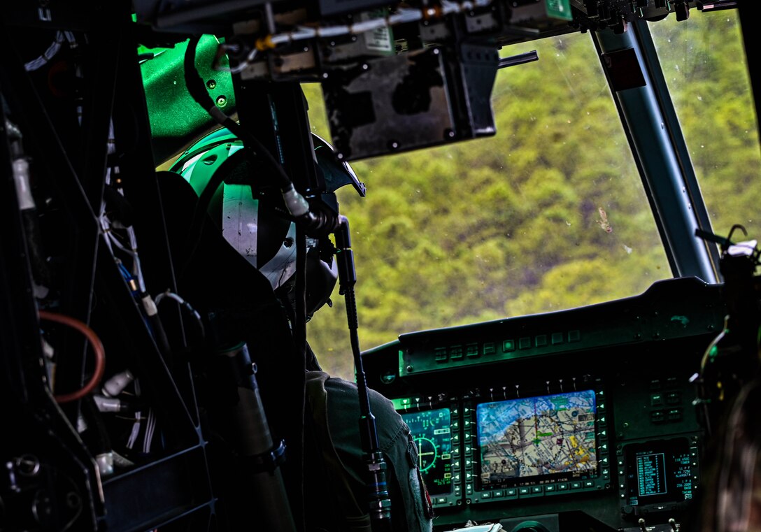 A U.S. Army Soldier assigned to the U.S. Army Reserve, 78th Training Division, pilots a UH-60 during Exercise Postal Warrior 2022 at Joint Base McGuire-Dix-Lakehurst, N.J. on 10 Aug, 2022. Postal Warrior 2022 is a standalone, task-focused exercise, designed to train and challenge postal units in the skill sets and competencies needed to support Theater Postal Operations and increase individual and collective readiness. Approximately 600 soldiers participated in the exercise, which included both classroom and simulated field training at the Army Support Activity Fort Dix Ranges. (U.S. Air Force photo by Staff Sgt. Sabatino Dimascio)