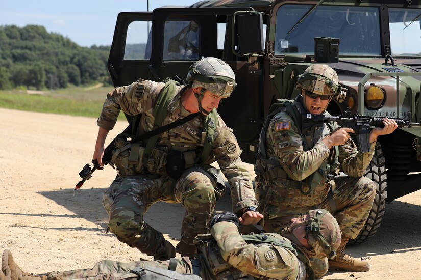 U.S. Army Reserve Soldiers assigned to the 888th Movement Control Team (MCT) Cranston, Rhode Island, assist a simulated-injured Soldier during convoy operations lane training at CSTX 86-22-02 at Fort McCoy, Wisconsin, August 16, 2022.