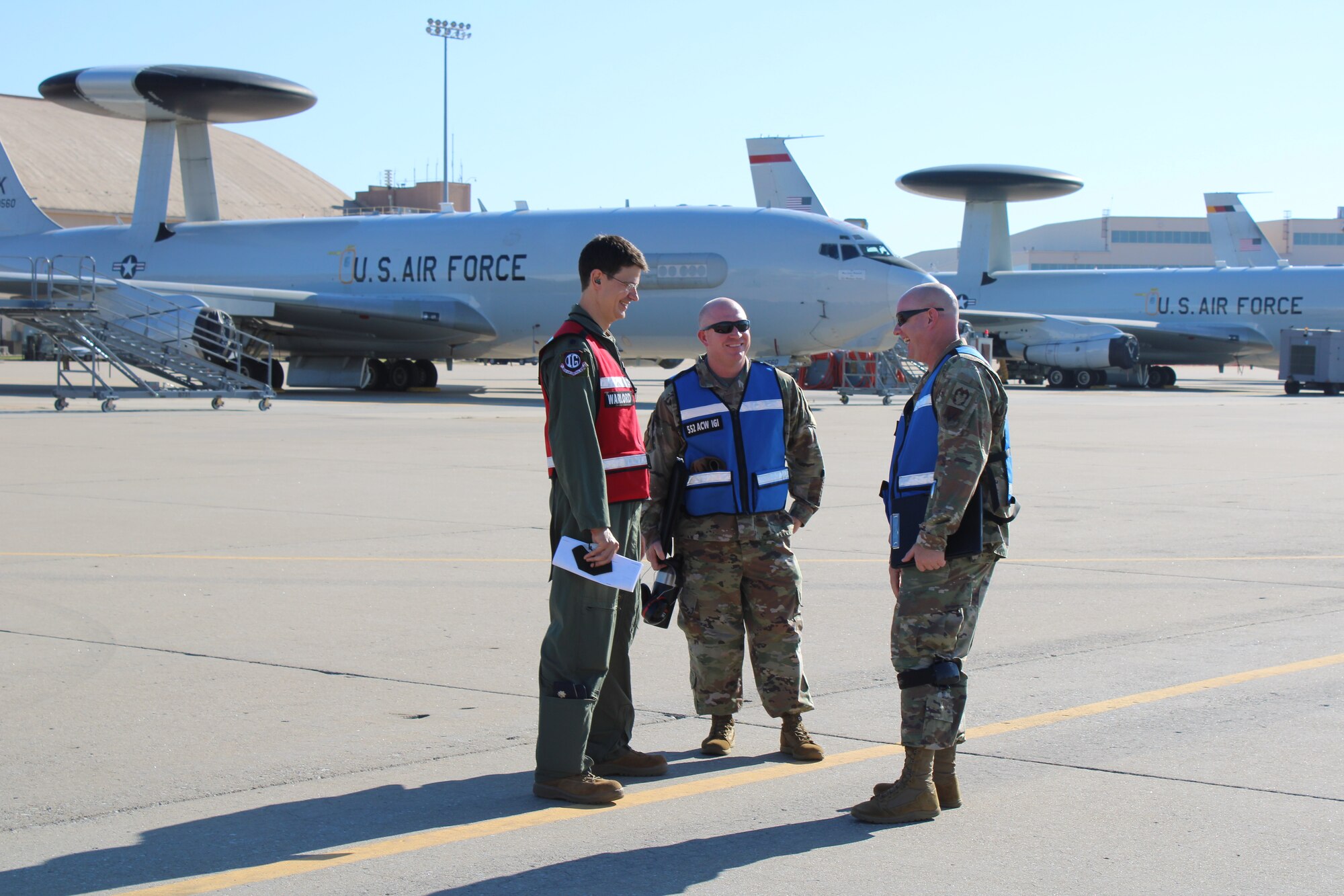 Inspector General staff discuss Agile Thunder 22-02 exercise on the flight line.