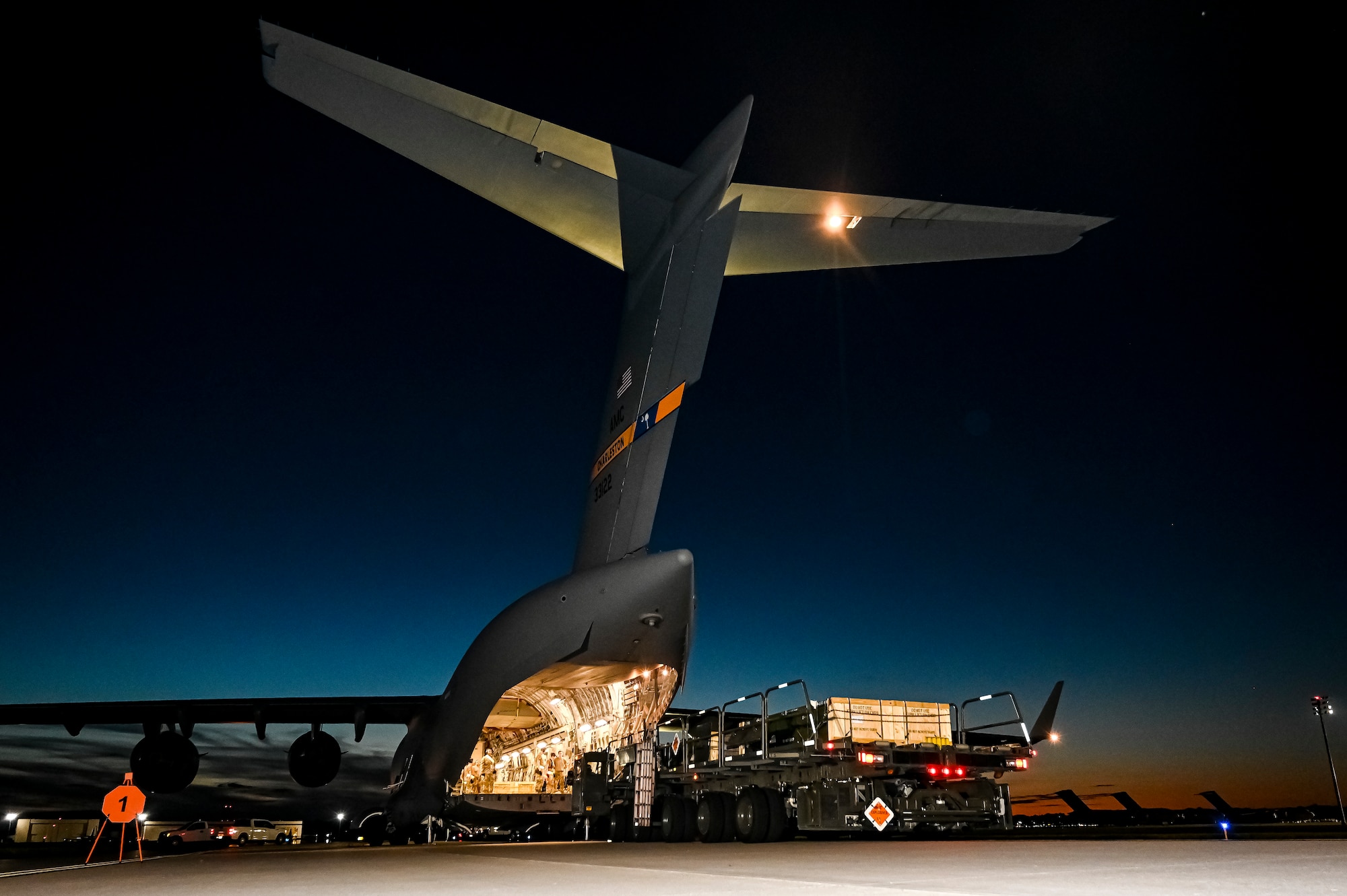 A C-17 Globemaster III assigned to the Air Mobility Command, prepares to receive the upload of Guided Multiple Launch Rocket System munitions at Joint Base McGuire-Dix-Lakehurst, N.J., Aug. 13, 2022. The munitions cargo is part of an additional security assistance package for Ukraine. The security assistance the U.S. is providing to Ukraine is enabling critical success on the battlefield against the Russian invading force. (U.S. Air Force photo by Senior Airman Matt Porter)