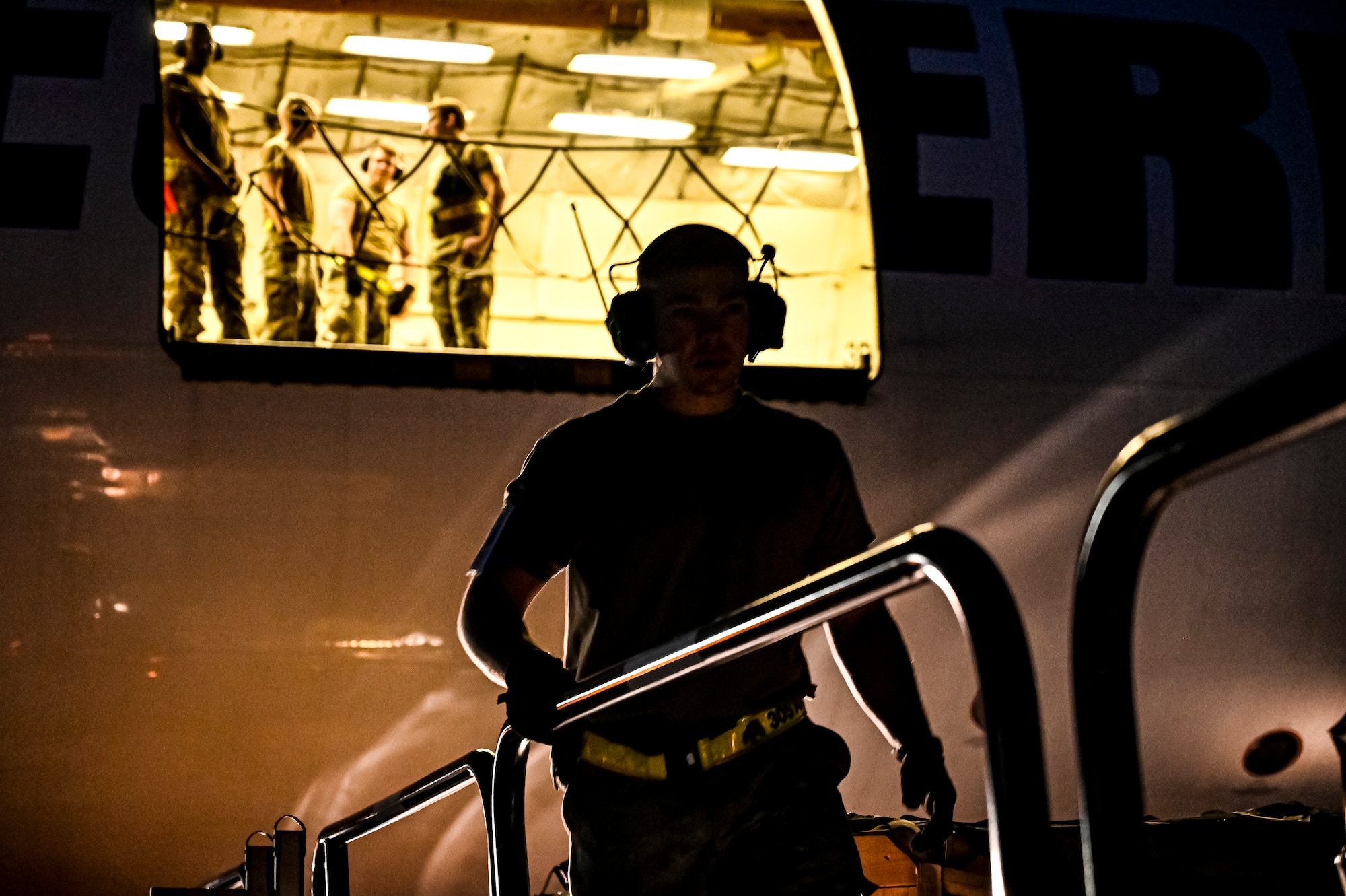 Airmen assigned to the 305th Aerial Port Squadron upload Guided Multiple Launch Rocket System munitions onboard a Boeing 767 at Joint Base McGuire-Dix-Lakehurst, N.J., Aug. 11, 2022. The munitions cargo is part of an additional security assistance package for Ukraine. The security assistance the U.S. is providing to Ukraine is enabling critical success on the battlefield against the Russian invading force. (U.S. Air Force photo by Senior Airman Matt Porter)