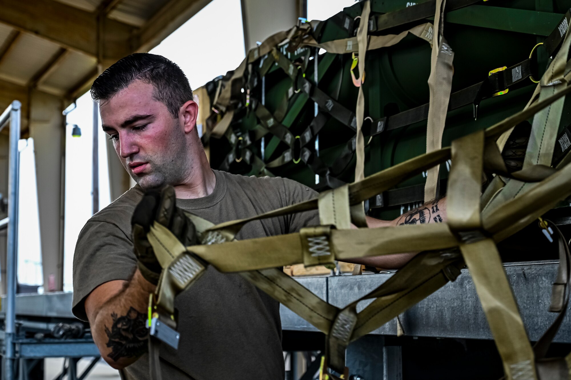 Senior Airman David Martinelli, 305th Aerial Port Squadron air transportation, assembles pallets of Guided Multiple Launch Rocket System munitions for upload to a Boeing 767 at Joint Base McGuire-Dix-Lakehurst, N.J., Aug. 12, 2022. The munitions cargo is part of an additional security assistance package for Ukraine. The security assistance the U.S. is providing to Ukraine is enabling critical success on the battlefield against the Russian invading force. (U.S. Air Force photo by Senior Airman Matt Porter)
