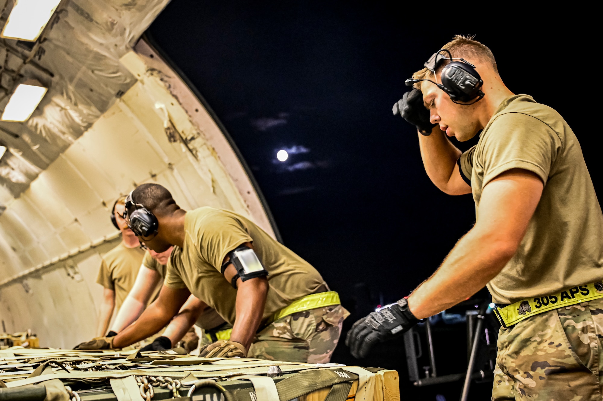 Airmen assigned to the 305th Aerial Port Squadron upload Guided Multiple Launch Rocket System munitions onboard a Boeing 767 at Joint Base McGuire-Dix-Lakehurst, N.J., Aug. 11, 2022. The munitions cargo is part of an additional security assistance package for Ukraine. The security assistance the U.S. is providing to Ukraine is enabling critical success on the battlefield against the Russian invading force. (U.S. Air Force photo by Senior Airman Matt Porter)