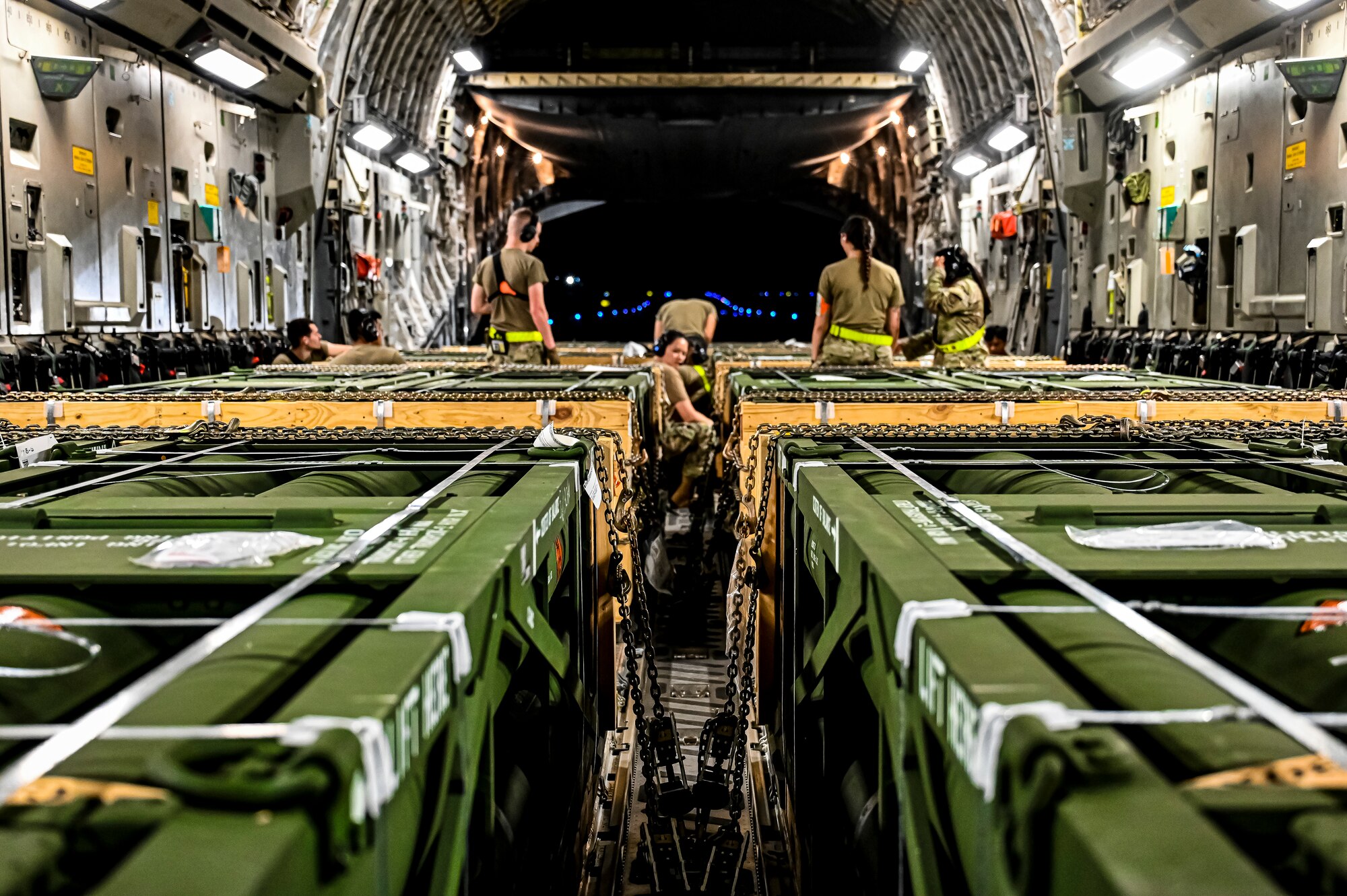 Airmen assigned to the 305th Aerial Port Squadron, upload Guided Multiple Launch Rocket System munitions onboard a Boeing 767 at Joint Base McGuire-Dix-Lakehurst, N.J., Aug. 13, 2022. The munitions cargo is part of an additional security assistance package for Ukraine. The security assistance the U.S. is providing to Ukraine is enabling critical success on the battlefield against the Russian invading force. (U.S. Air Force photo by Senior Airman Matt Porter)