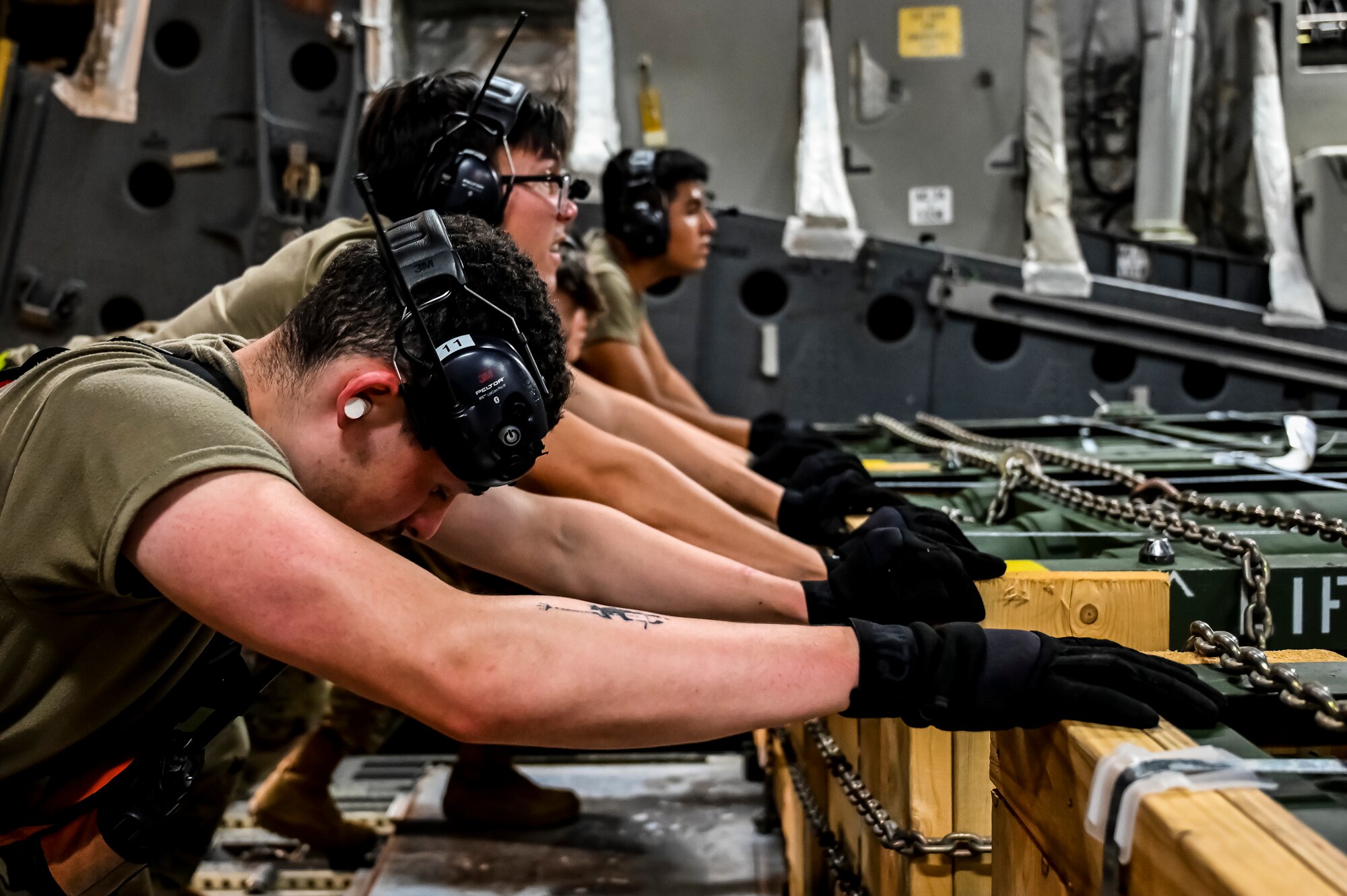 Airmen assigned to the 305th Aerial Port Squadron, upload Guided Multiple Launch Rocket System munitions onboard a Boeing 767 at Joint Base McGuire-Dix-Lakehurst, N.J., Aug. 13, 2022. The munitions cargo is part of an additional security assistance package for Ukraine. The security assistance the U.S. is providing to Ukraine is enabling critical success on the battlefield against the Russian invading force. (U.S. Air Force photo by Senior Airman Matt Porter)