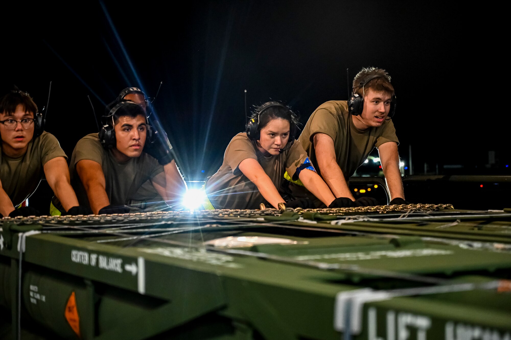 Airmen assigned to the 305th Aerial Port Squadron, upload Guided Multiple Launch Rocket System munitions onboard a Boeing 767 at Joint Base McGuire-Dix-Lakehurst, N.J., Aug. 13, 2022. The munitions cargo is part of an additional security assistance package for Ukraine. The security assistance the U.S. is providing to Ukraine is enabling critical success on the battlefield against the Russian invading force. (U.S. Air Force photo by Senior Airman Matt Porter)
