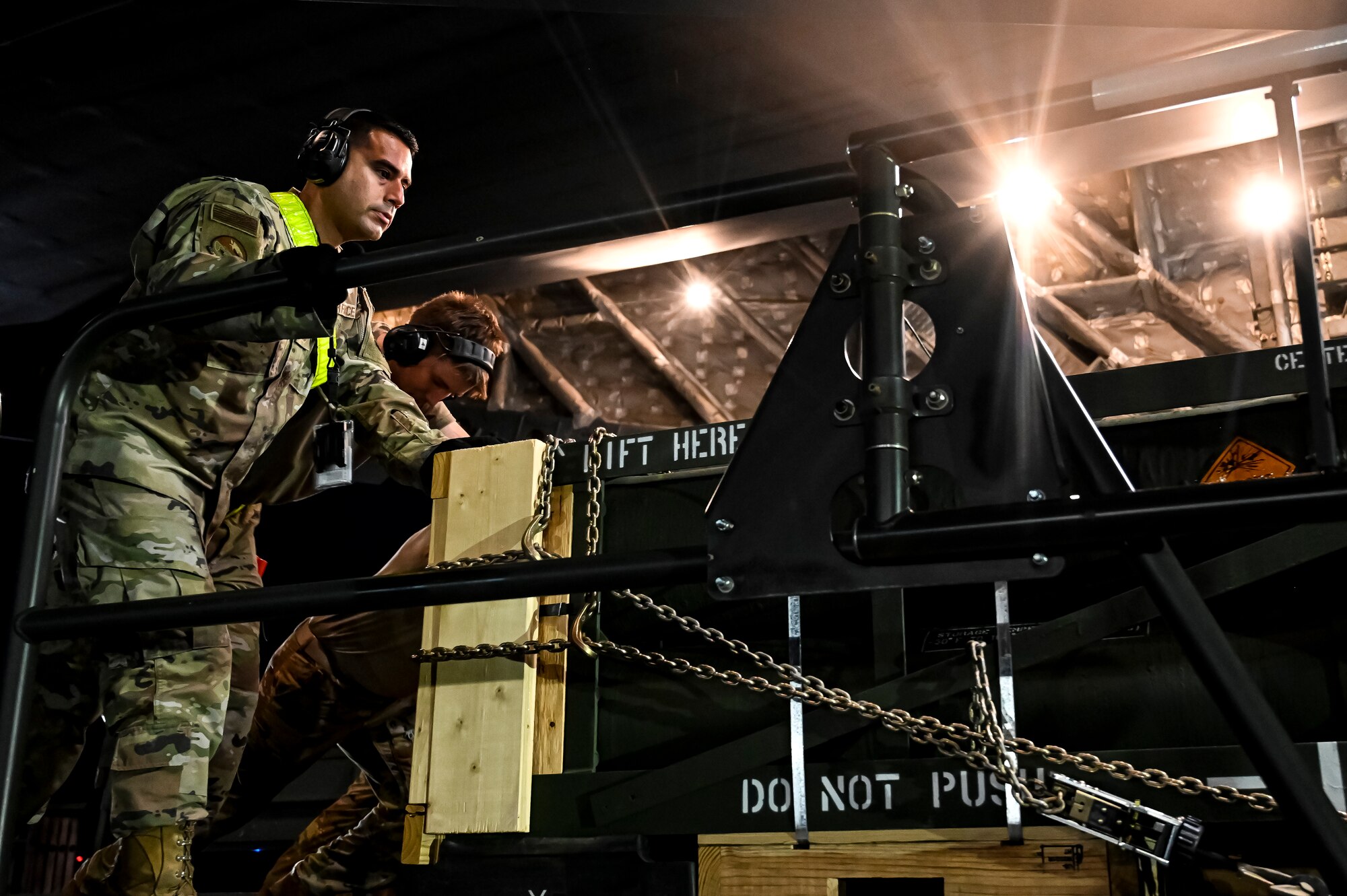 U.S. Air Force Master Sgt. Joshua Greenbaum, 305th Aerial Port Squadron air transportation, prepares the upload of Guided Multiple Launch Rocket System munitions to a C-17 Globemaster III at Joint Base McGuire-Dix-Lakehurst, N.J., Aug. 13, 2022. The munitions cargo is part of an additional security assistance package for Ukraine. The security assistance the U.S. is providing to Ukraine is enabling critical success on the battlefield against the Russian invading force. (U.S. Air Force photo by Senior Airman Matt Porter)