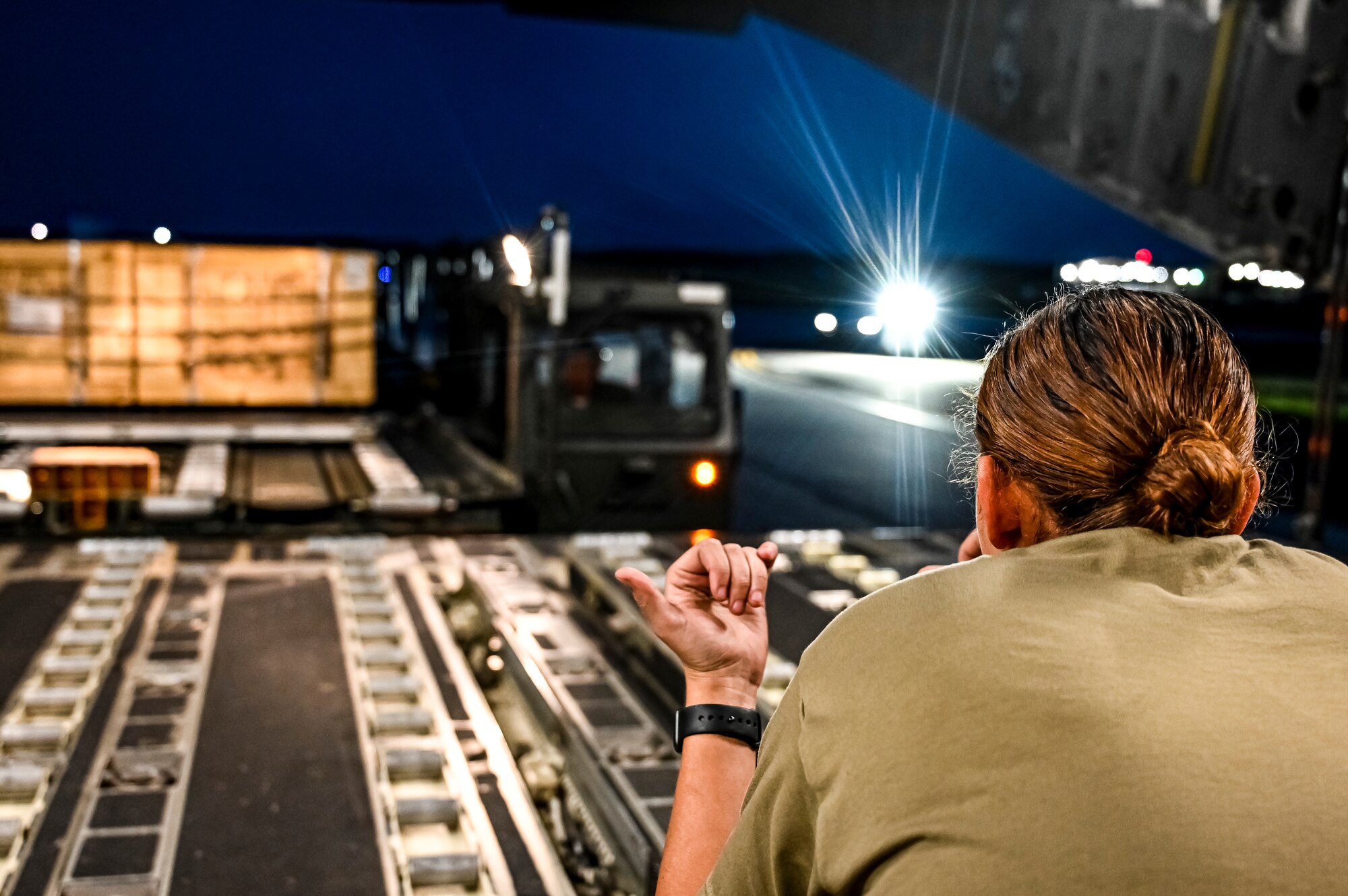 Senior Airman Natasha Mundt, 14th Airlift Squadron loadmaster, prepares the upload of Guided Multiple Launch Rocket System munitions to a C-17 Globemaster III at Joint Base McGuire-Dix-Lakehurst, N.J., Aug. 13, 2022. The munitions cargo is part of an additional security assistance package for Ukraine. The security assistance the U.S. is providing to Ukraine is enabling critical success on the battlefield against the Russian invading force.  (U.S. Air Force photo by Senior Airman Matt Porter)