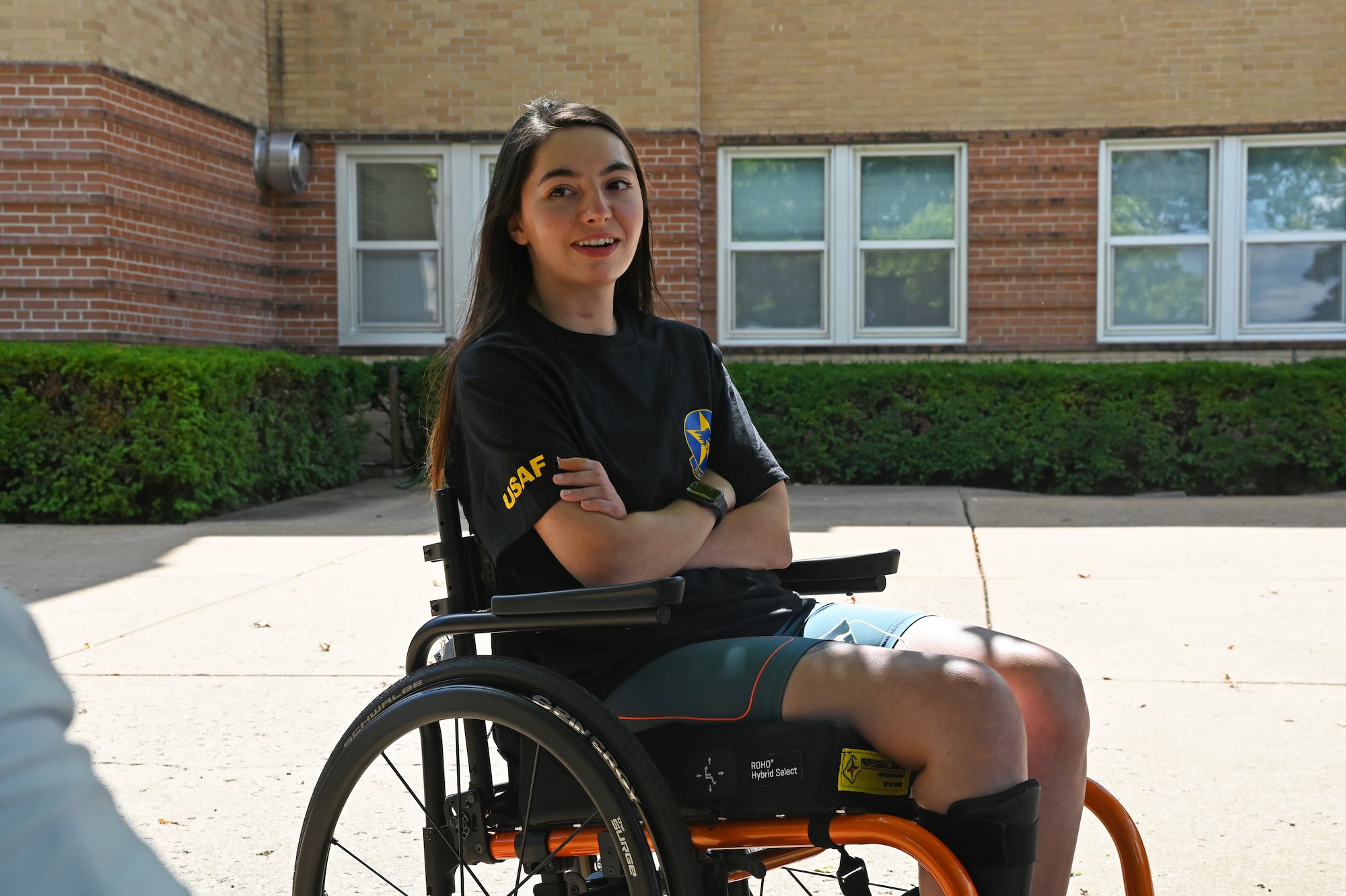 U.S. Air Force Airman 1st Class Lauren Arduser, 311th Training Squadron Russian language analyst, actively listens in a conversation, at the St. Louis VA Healthcare System-Jefferson Barracks, Missouri, August 17, 2022. Arduser was diagnosed with quadriplegia after a vehicle accident in March. Through personal resilience, Auduser has made significant improvements and can move every limb. (U.S. Air Force photo by Senior Airman Abbey Rieves)