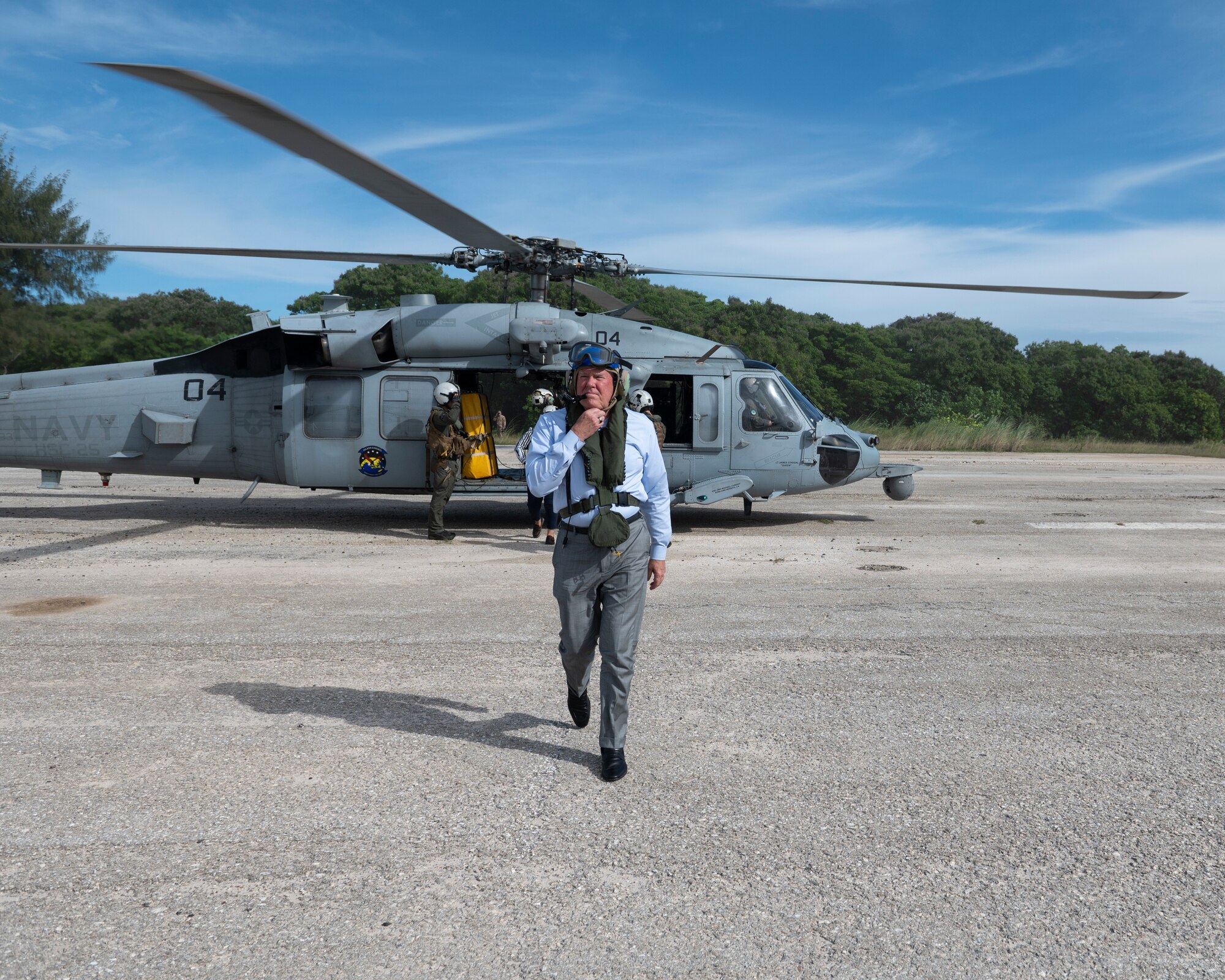 Secretary of the Air Force Frank Kendall exits a U.S. Navy MH-60S Seahawk during his visit at Andersen Air Force Base, Guam, Aug. 19, 2022.