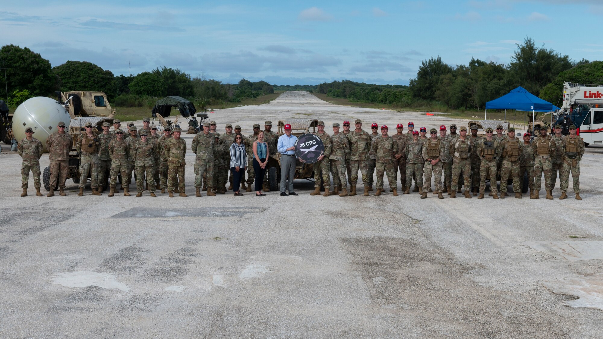 Secretary of the Air Force Frank Kendall and Airmen from the 36th Contingency Response Group pose for a photo during his visit to Andersen Air Force Base, Guam, Aug.19, 2022.