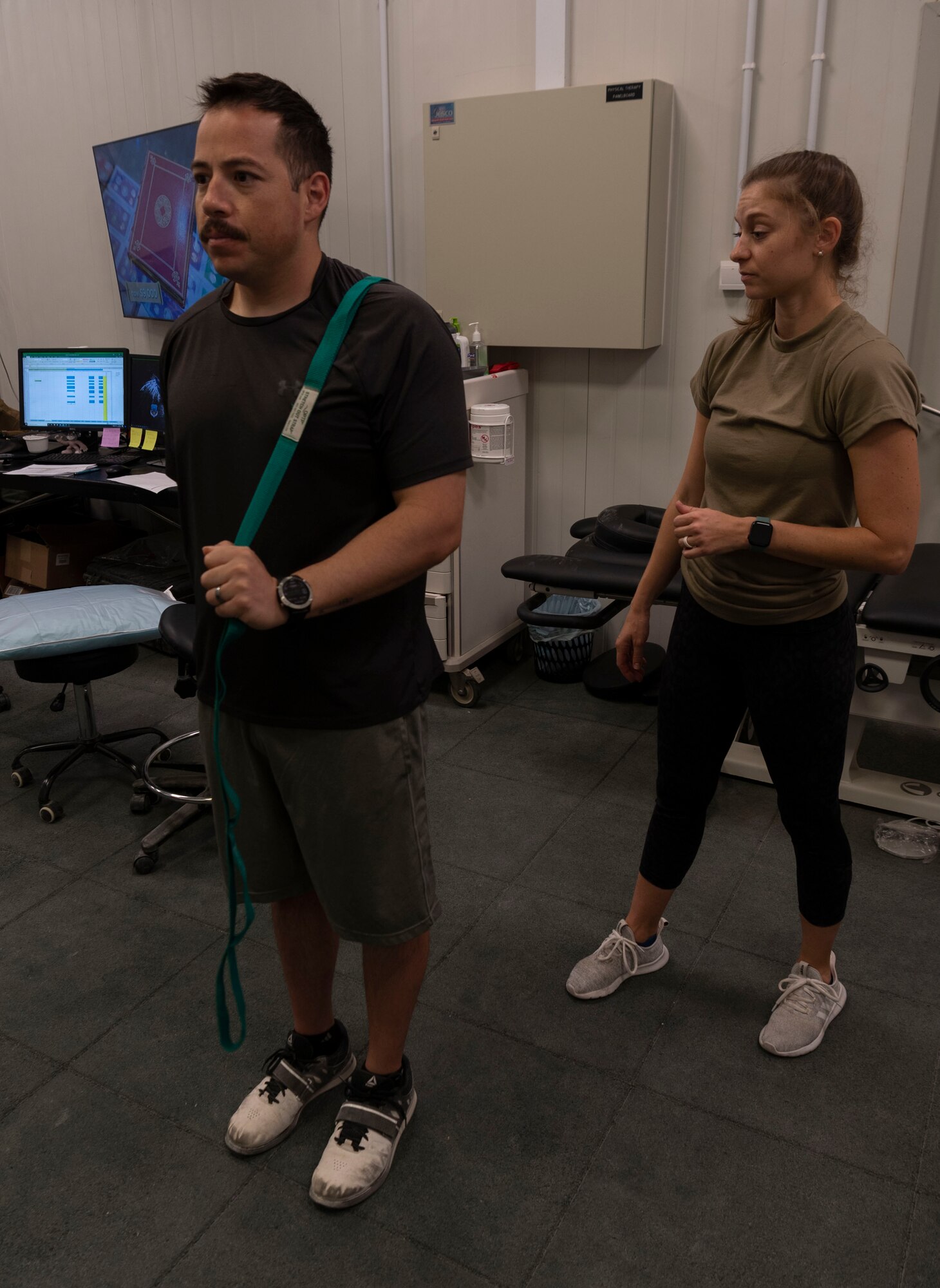 Major Kristen Stanford, 332d Expeditionary Medical Squadron, Human Performance Flight Commander, explains rehabilitation and exercise treatment for injured Airmen.