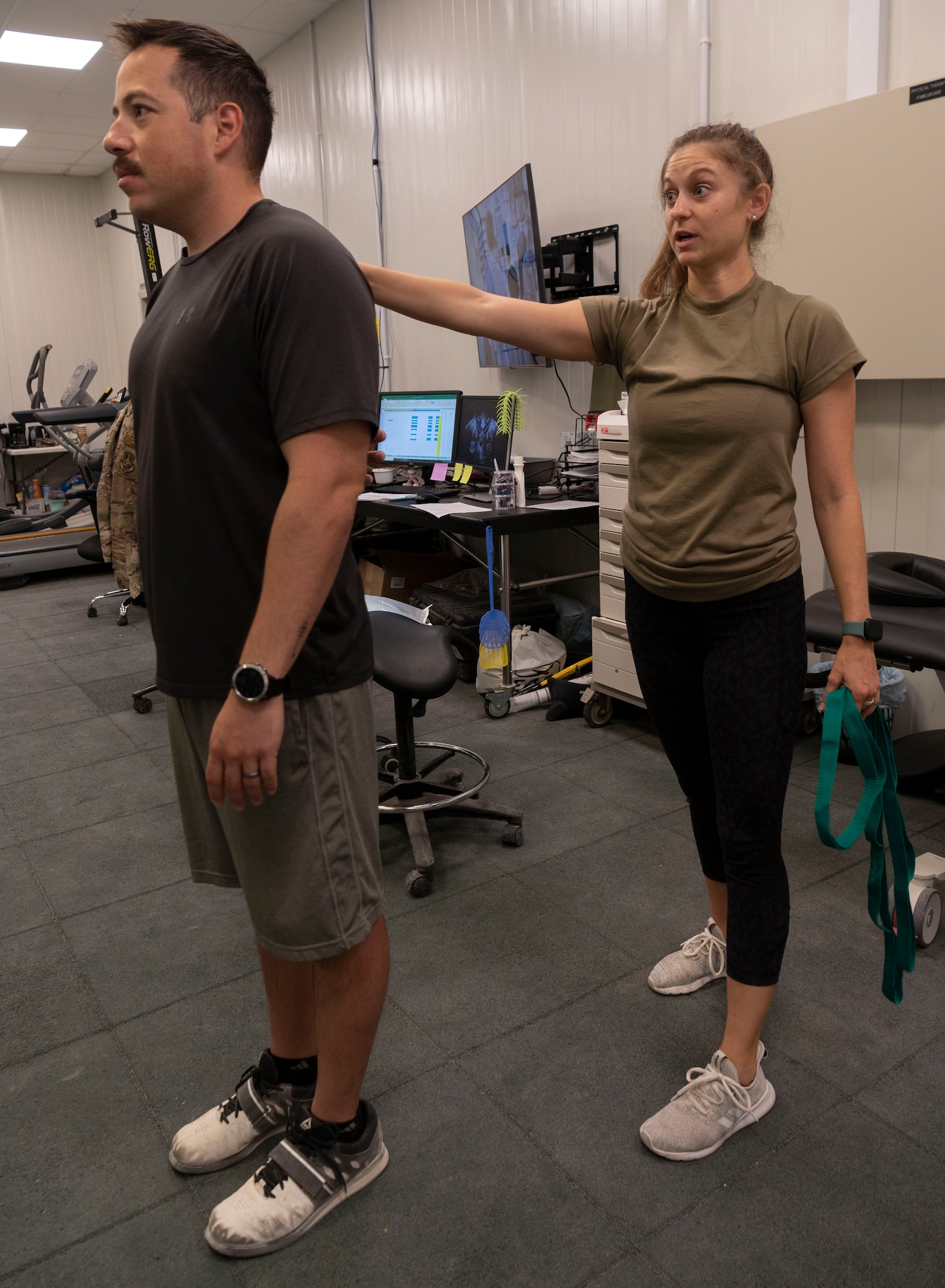 Major Kristen Stanford, 332d Expeditionary Medical Squadron, Human Performance Flight Commander, explains rehabilitation and exercise treatment for injured Airmen.