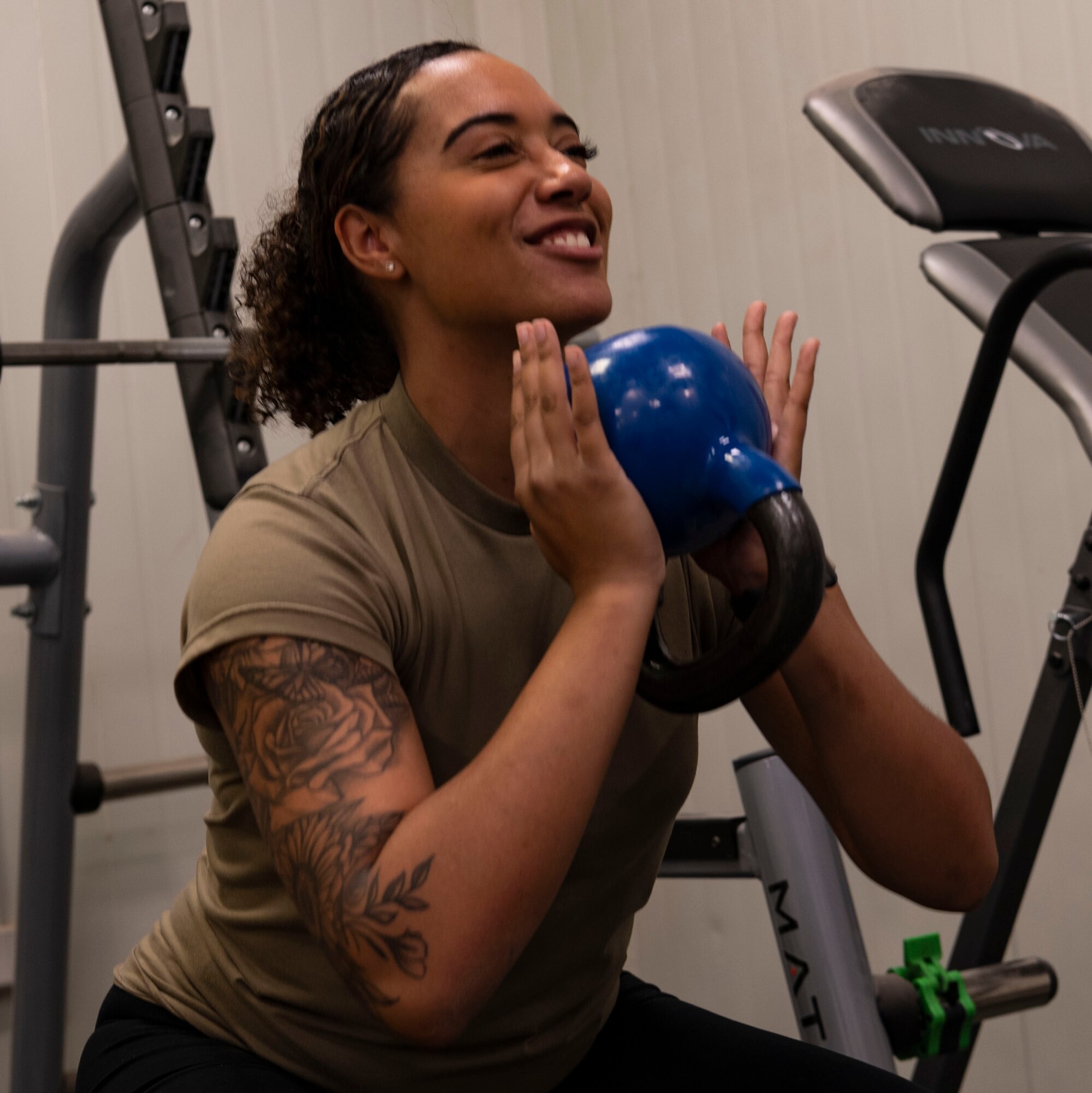 Senior Airman Tyra Hazelhoff Mitchell, 332d Expeditionary Medical Squadron, Physical Therapist Technician, explains rehabilitation and exercise treatment for injured Airmen.