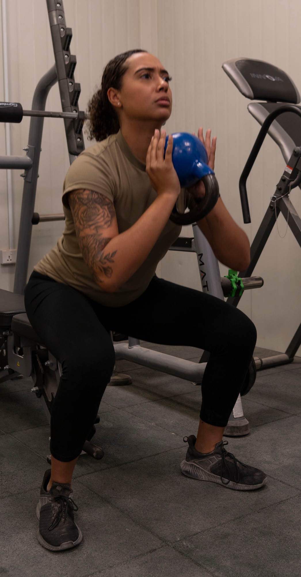Senior Airman Tyra Hazelhoff Mitchell, 332d Expeditionary Medical Squadron, Physical Therapist Technician, explains rehabilitation and exercise treatment for injured Airmen.