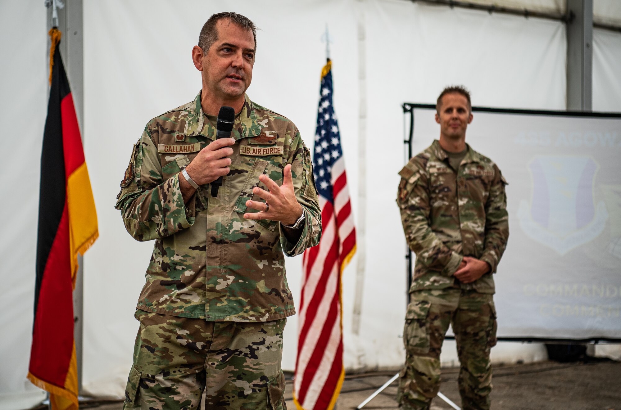 U.S. Air Force Col. Bryan Callahan, 435th Air Ground Operations Wing commander, speaks during a 435th AGOW Family Fun Event at Ramstein Air Base, Germany, Aug. 18, 2022. During the event, the wing also held its Quarterly Awards ceremony where Airmen were recognized for their many accomplishments. (U.S. Air Force photo by Airman 1st Class Jared Lovett)