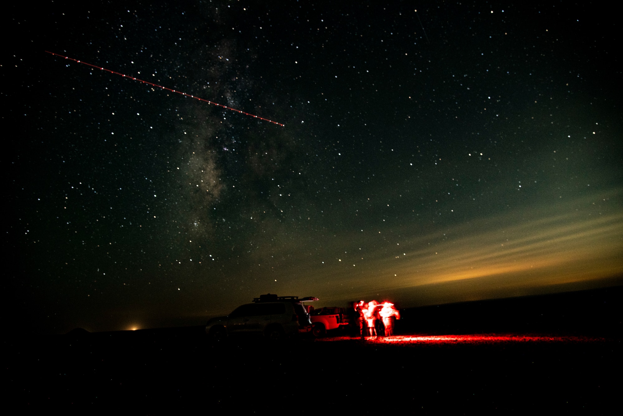 U.S. Air Force Tactical Air Control Party specialists with Combined Special Operations Task Force - Levant and the 335th Expeditionary Fighter Squadron along with Joint Forward Observers with the Army and Naval Special Warfare conduct AC-130 and Fighter Integration at an undisclosed location in Southwest Asia, August 19th, 2022. Long exposure photos. (U.S. Air Force photo by: Tech. Sgt. Jim Bentley)