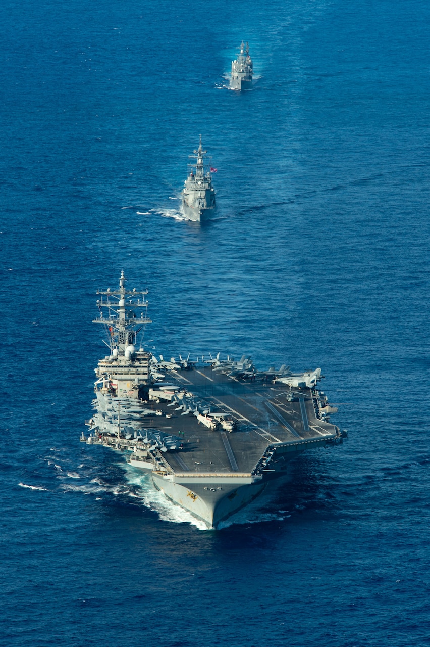 PHILIPPINE SEA (Aug. 16, 2022) The U.S. Navy’s only forward-deployed aircraft carrier USS Ronald Reagan (CVN 76), the Japan Maritime Self-Defense Force (JMSDF) JS Ohnami (DD 111) and JS Yamagiri (DD 152) steam in formation in the Philippine Sea, Aug. 16. The U.S. Navy and JMSDF routinely conduct naval exercises together, strengthening the U.S.-Japan alliance and maintaining a free and open Indo-Pacific region. Ronald Reagan, the flagship of Carrier Strike Group 5, provides a combat-ready force that protects and defends the United States, and supports alliances, partnerships and collective maritime interests in the Indo-Pacific region. (U.S. Navy Photo by Mass Communication Specialist 2nd Class Caleb Dyal)