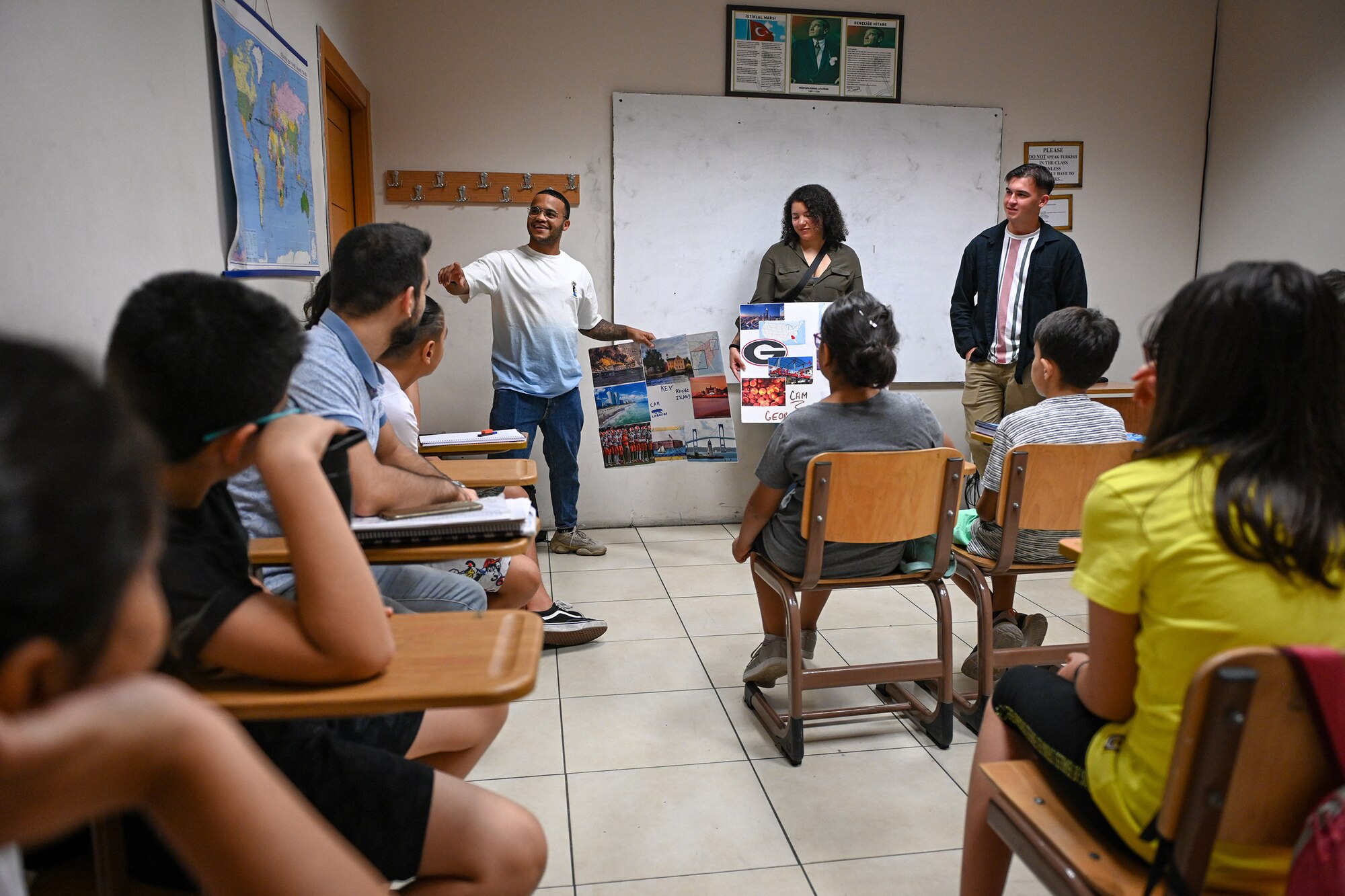 Airmen assigned to 39th Air Base Wing (ABW) currently attending Airman Leadership School (ALS) give a brief presentation on American culture at the Turkish-American Association (TAA) in Adana, Turkey, Aug. 23, 2022.