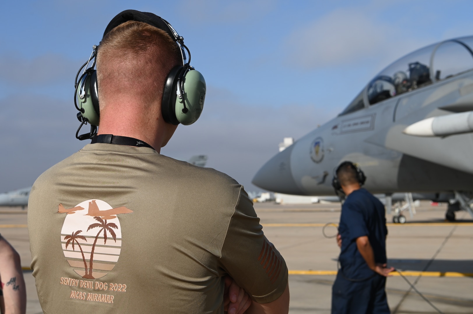 U.S. Air Force Tech. Sgt. Cody Burkett, 173rd Fighter Wing, Oregon Air National Guard, observes preflight operations at Marine Corps Air Station Miramar in California Aug. 15, 2022. The 173rd Fighter Wing spent two weeks flying and training with the F/A-18s from the Marine Fighter Attack Training Squadron 101 and the F-35s from the Marine Fighter Attack Training Squadron 502.