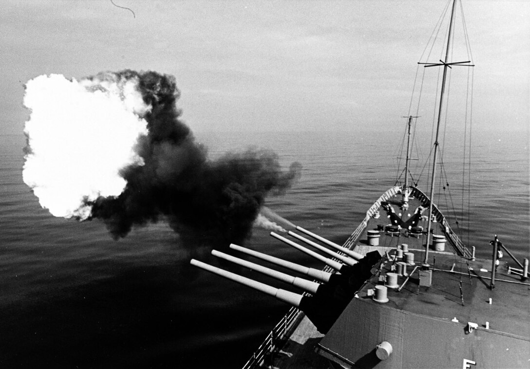 The USS NEWPORT NEWS (CA-148) fires its big 8-inch/55 caliber gun to provide support for Allied Forces fighting the ground war in Vietnam just south of the DMZ (Demilitarized Zone) during Operation Sea Dragon, October 1967.