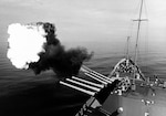 The USS NEWPORT NEWS (CA-148) fires its big 8-inch/55 caliber gun to provide support for Allied Forces fighting the ground war in Vietnam just south of the DMZ (Demilitarized Zone) during Operation Sea Dragon, October 1967.