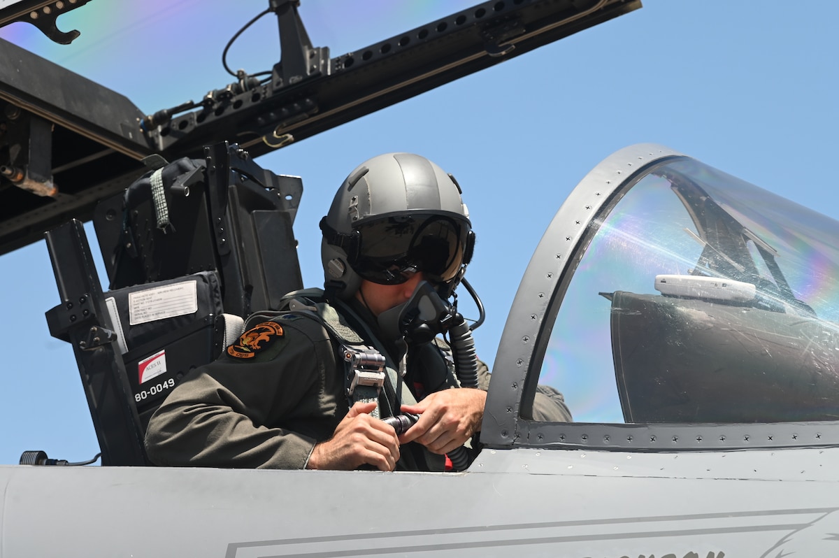 U.S. Air Force  Lt. Col. Adrian Anulewicz, 173rd Fighter Wing F-15 pilot, straps into the cockpit of an F-15 Eagle in preparation for a flight at Marine Corps Air Station Miramar Aug. 15, 2022.  The 173rd Fighter Wing trained for two weeks with the F/A-18s from the Marine Fighter Attack Training Squadron 101 and the F-35s from the Marine Fighter Attack Training Squadron 502.
