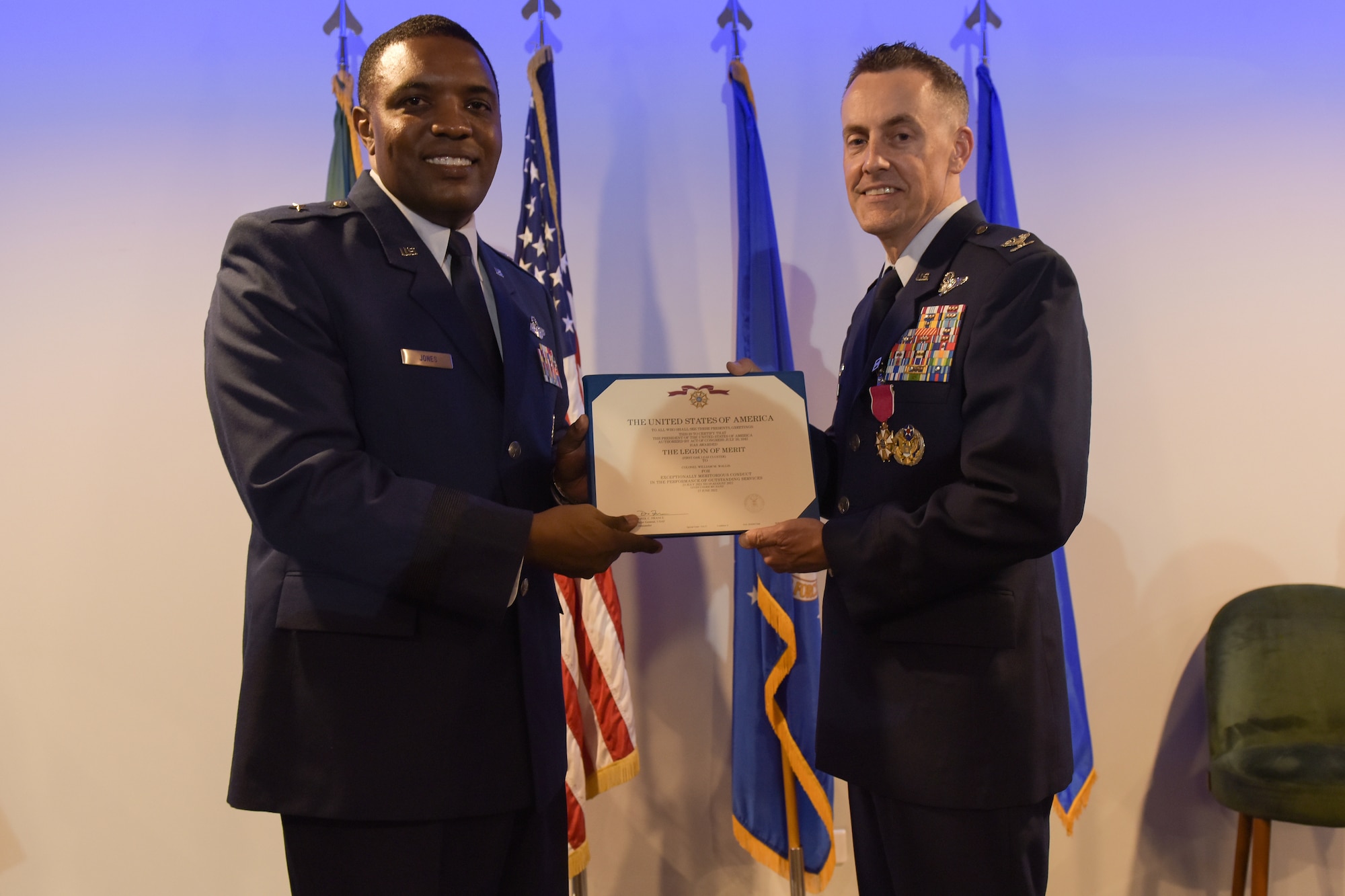 Gen. Jones gives Col. Wallis a certificate