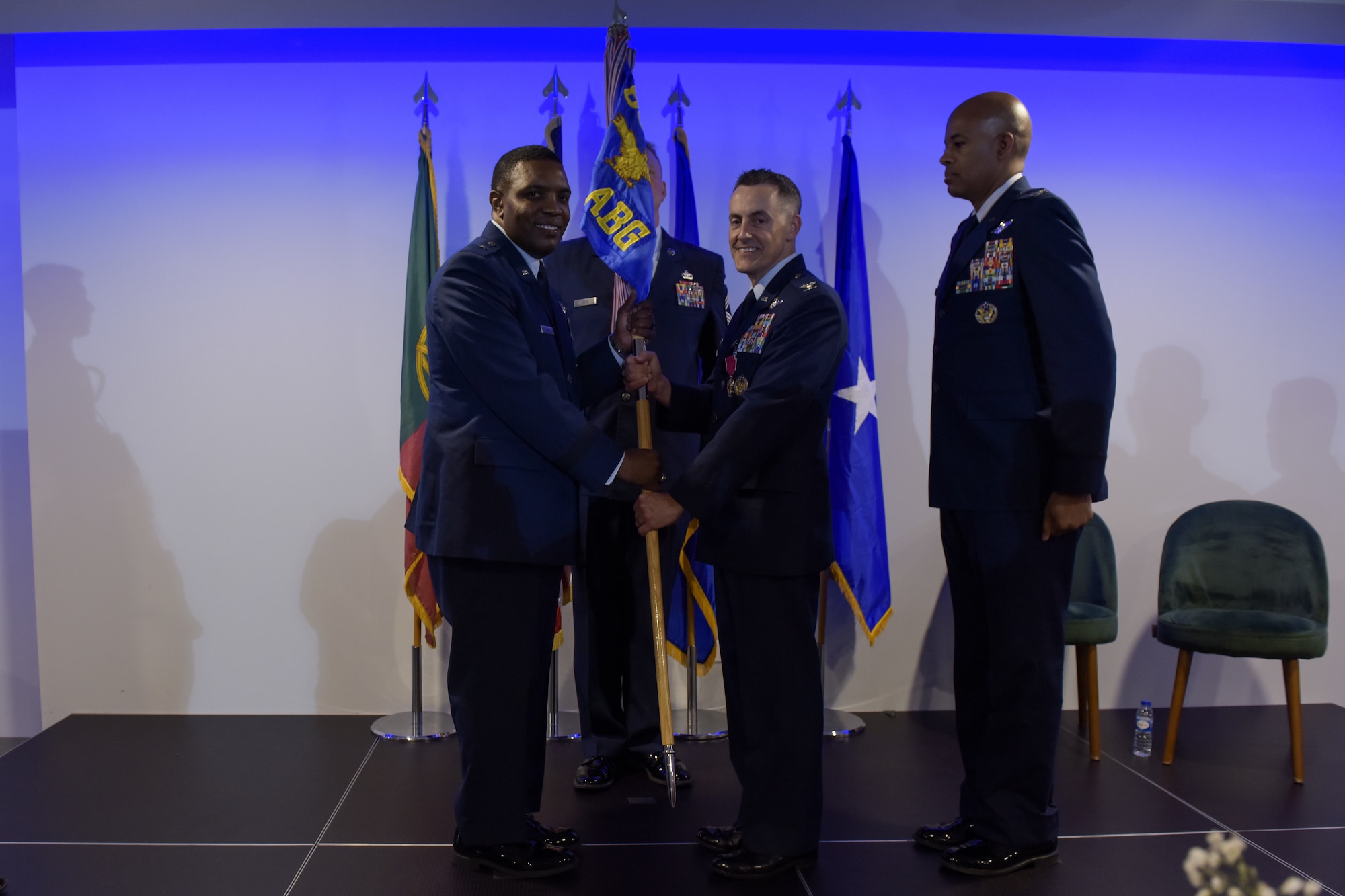 Gen. Jones gives Col. Wallis a flag