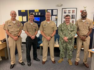 ALEXANDRIA, Va. (Aug. 16, 2022) From left, Naval Education and Training Command (NETC) Force Master Chief Matt Harris, Machinist's Mate (nuclear power) 1st Class Kevin McElroy, NETC Commander Rear Adm. Pete Garvin, Fire Controlman 1st Class Cody Korum and Chief Navy Counselor Timothy Wilcox pose for a photo at Navy Recruiting Station Alexandria, Virginia, Aug. 16, 2022. As the owner of the Force Development pillar within MyNavy HR, NETC recruits, trains and delivers those who serve the nation, taking them from "street to fleet" by transforming civilians into highly skilled, operational, and combat ready warfighters. (U.S. Navy photo by Lt. Steve Nieto)