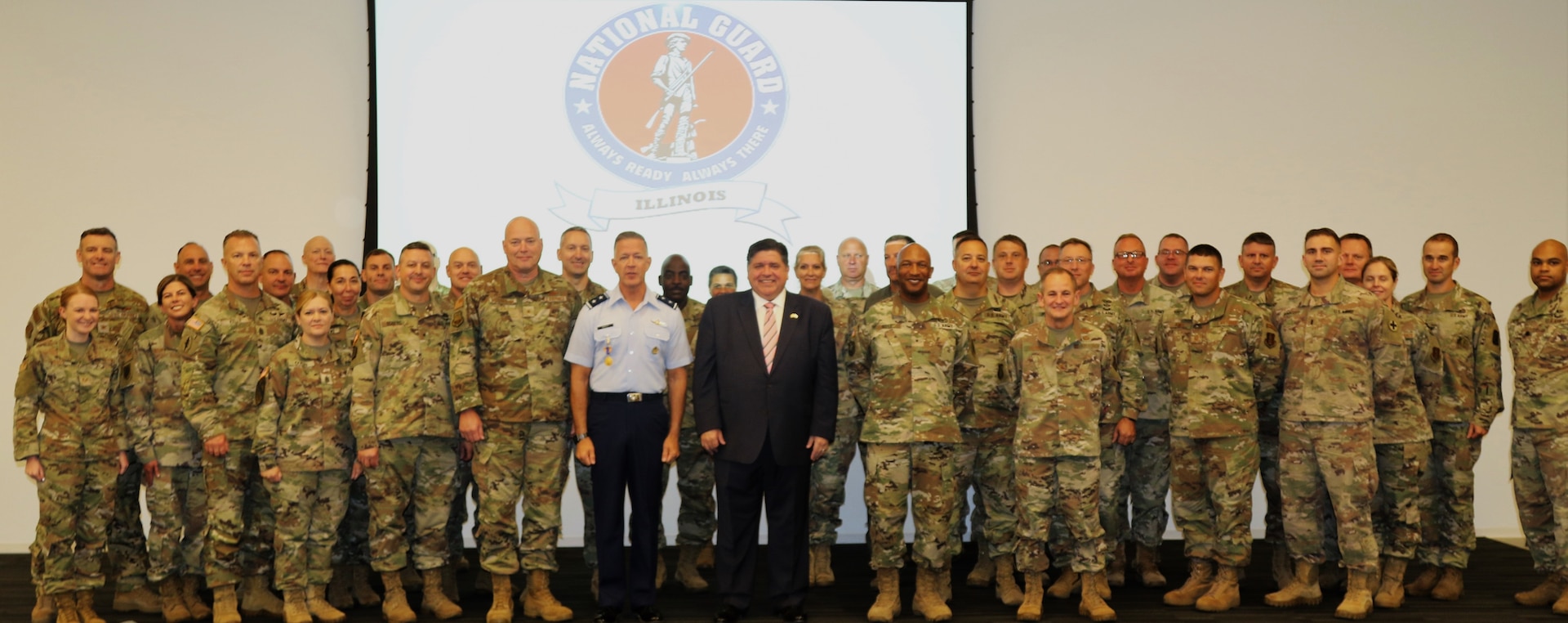 Illinois Governor JB Pritzker, Maj. Gen. Rich Neely, the Adjutant General of Illinois and the Commander of the Illinois National Guard, and participants in the Illinois National Guard's quarterly Senior Leader Engagement pose for a group photo.