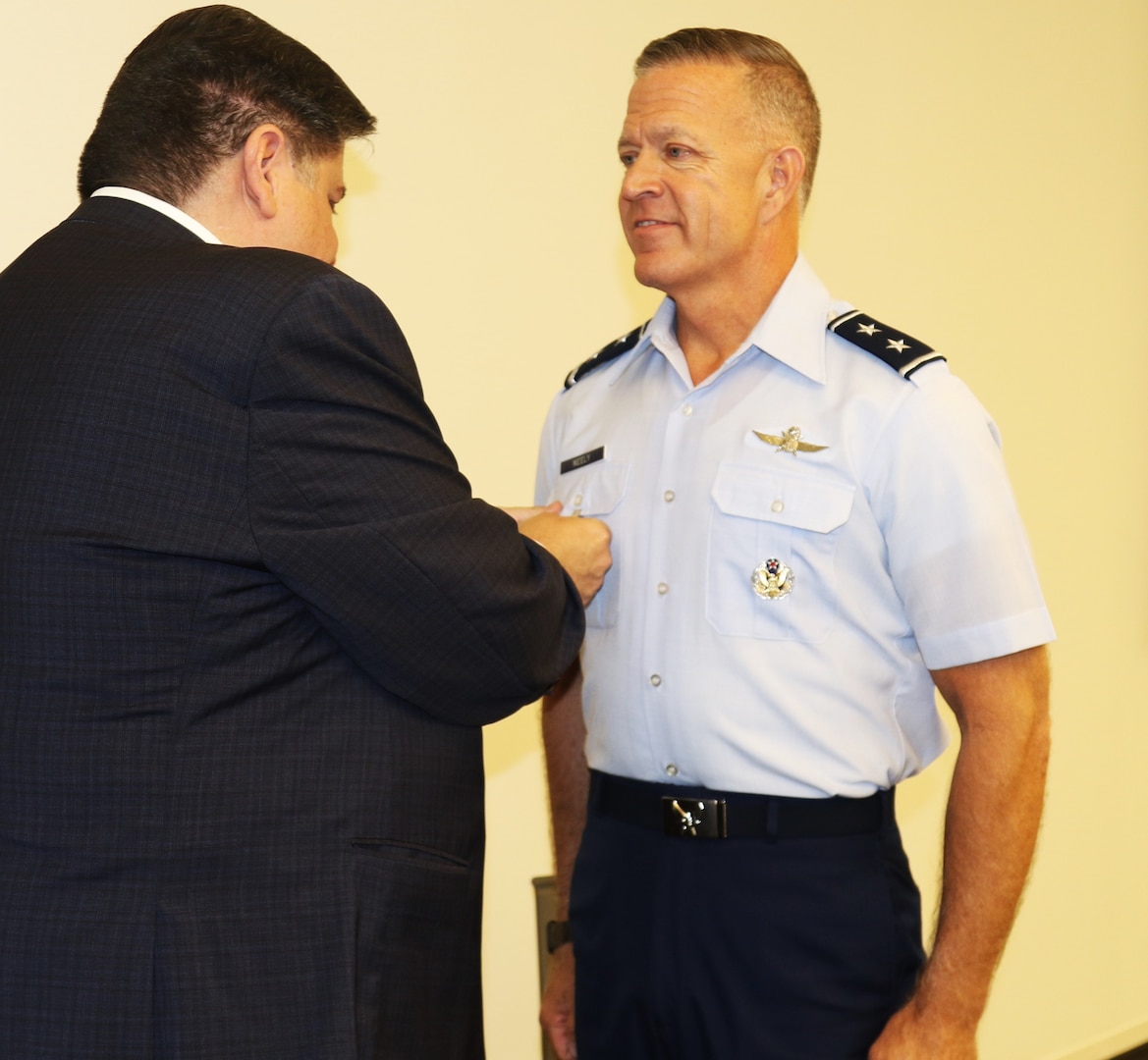 Illinois Governor JB Pritzker awards Maj. Gen. Rich Neely, the Adjutant General of Illinois and the Commander of the Illinois National Guard, with the Illinois Distinguished Service Medal for his "leadership and poise" during the COVID-19 pandemic.