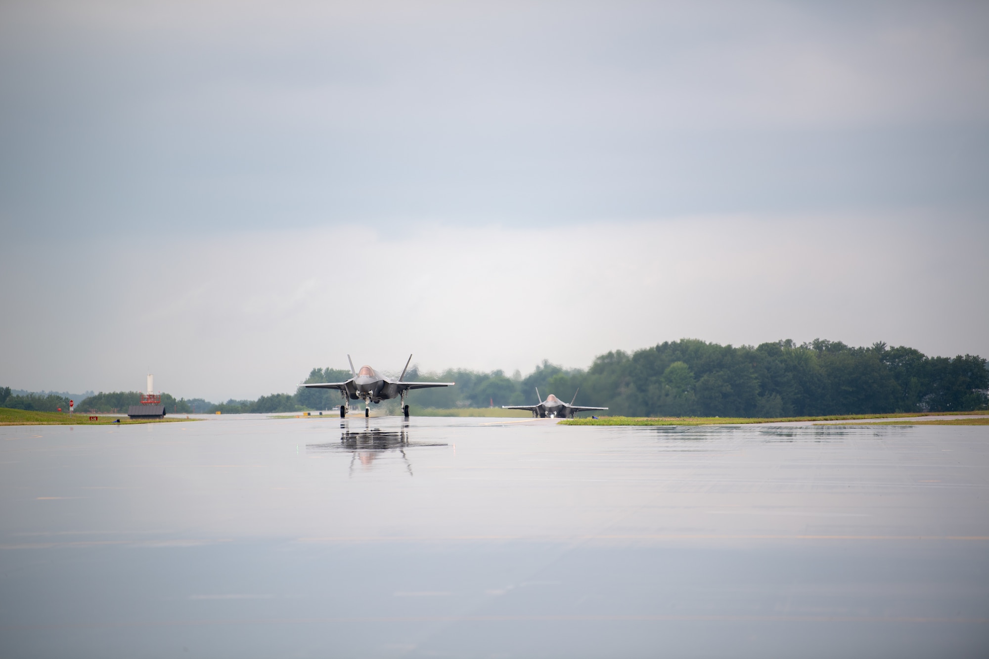 Photo of Aircraft and Airmen returning home from an overseas deployment on Aug. 2, 2022 in South Burlington, Vermont. This week, F-35A Lightning II Aircraft, equipment, and personnel from the 158th Fighter Wing begin returning home from a three month overseas deployment at Spangdahlem Air Base, Germany. (U.S. Air National Guard photo by Senior Master Sgt. Michael Davis)