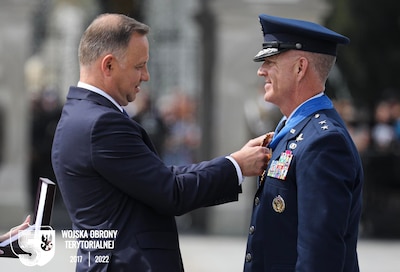 Polish President Andrzej Duda awarded Maj. Gen. Rich Neely, the Adjutant General of Illinois and Commander of the Illinois National Guard, with the “Commander’s Cross with Star of the Order of Merit of the Republic of Poland” during a Polish Armed Forces Day celebration in Warsaw, Poland, on Aug. 15.