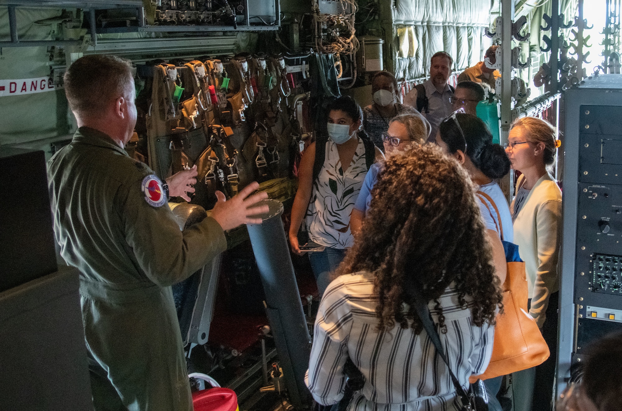 Lt. Col. Sean Cross speaks to staffers on a WC-130J Super Hercules