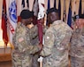 Col. Tony Nesbitt, center, commander of U.S. Army Medical Logistics Command, passes the colors of the U.S. Army Medical Materiel Agency to incoming commander, Col. Gary Cooper. Cooper assumed command from outgoing commander, Col. Ryan Bailey, right, during a change of command ceremony Aug. 19 at Fort Detrick, Maryland. The ceremony also served as an assumption of responsibility for Sgt. Maj. Hugo Roman, USAMMA’s new senior enlisted leader. USAMMA is a direct reporting unit to AMLC, the Army’s life cycle management command for medical materiel.