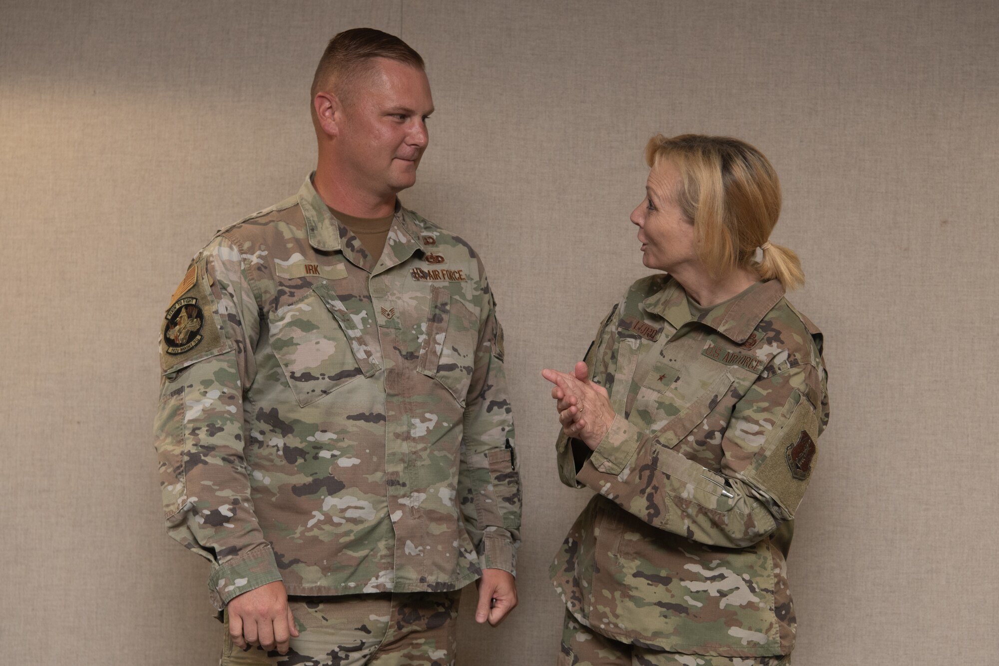 Two Airmen pose for a photo.