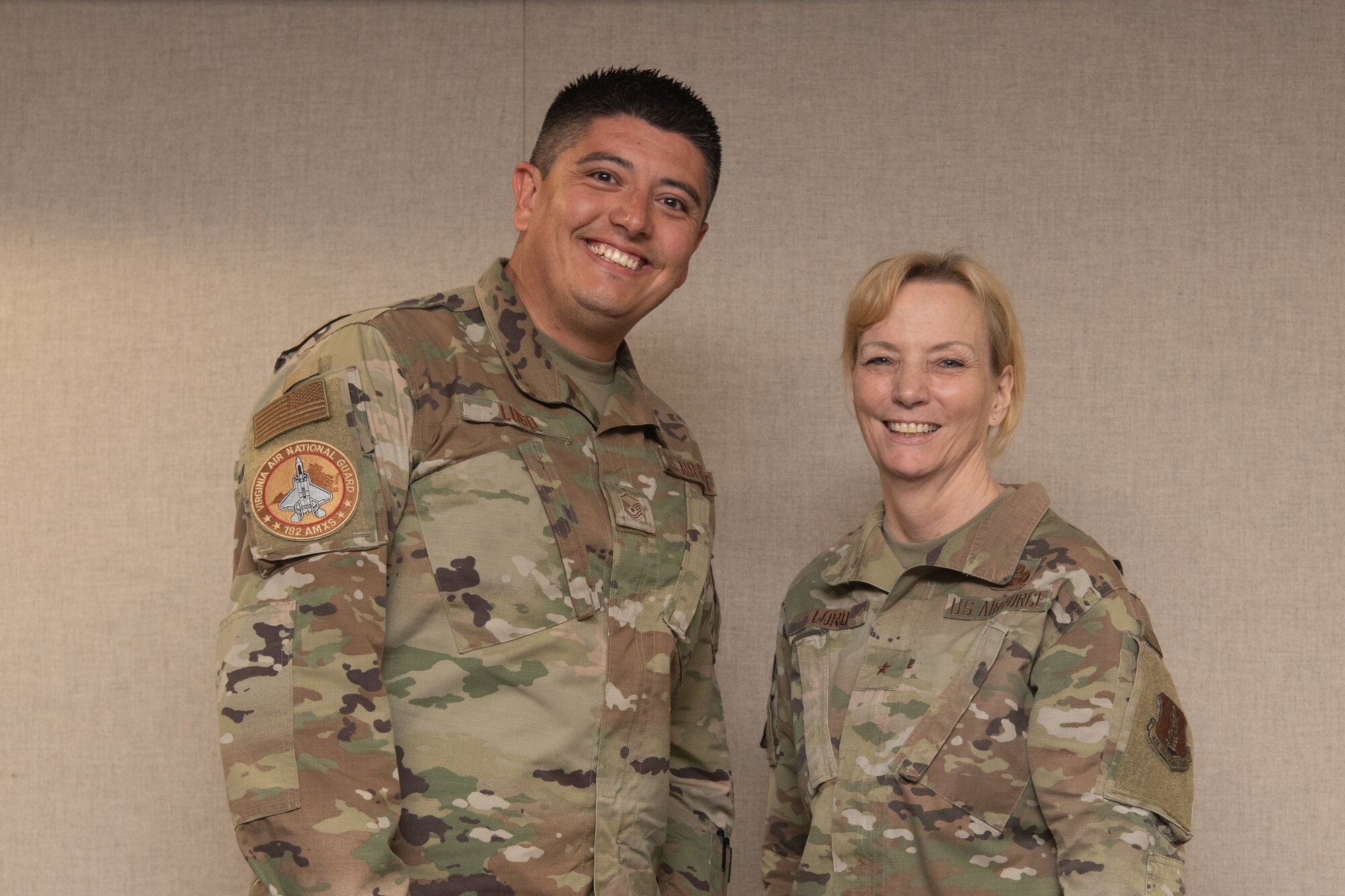 Two Airmen pose for a photo.