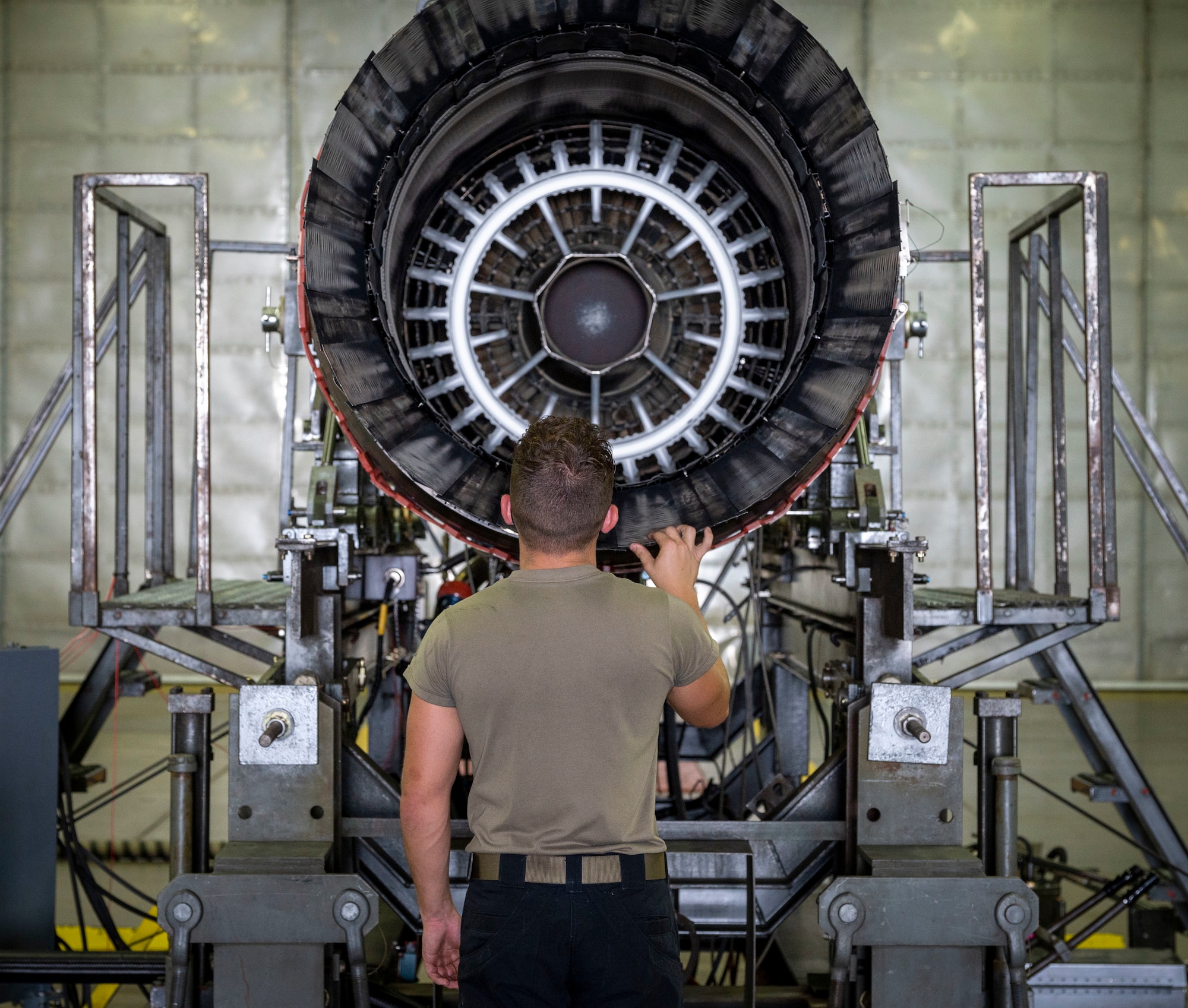 Airman 1st Class Noah Mercer, 4th Component Maintenance Squadron aerospace propulsion technician, inspects the engine of an F-15E Strike Eagle at Seymour Johnson Air Force Base, North Carolina, August 10, 2022. Mercer inspected the engine for foreign object debris to ensure the engine does not malfunction or have dangerous afterburns. (U.S. Air Force photo by Airman 1st Class Sabrina Fuller)