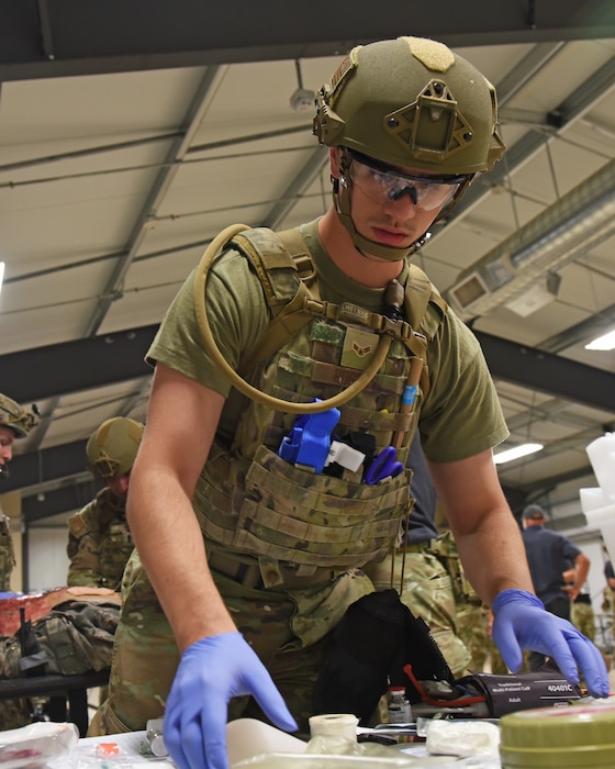 U.S. Air Force Airman 1st Class Noah Rogers, 17th Healthcare Operations Squadron aerospace medical technician, searches a table for medical equipment at Melrose Air Force Range, N.M. August 16, 2022. The Medic Rodeo is designed to test the skills of Air Force medical technicians in both deployed and home installation environments. (U.S. Air Force photo by Airman 1st Class Zachary Heimbuch)