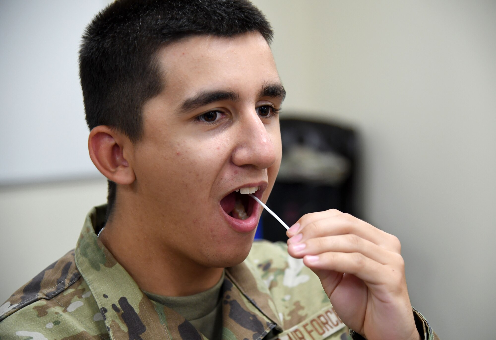 U.S. Air Force Airman Samuel Lozano, 334th Training Squadron student, collects a swab sample during a bone marrow donor registration drive inside Cody Hall at Keesler Air Force Base, Mississippi, Aug. 23, 2022. The 81st Training Group partnered with Second Air Force and the Salute to Life program to host the drive throughout the week at the various training squadrons. (U.S. Air Force photo by Kemberly Groue)