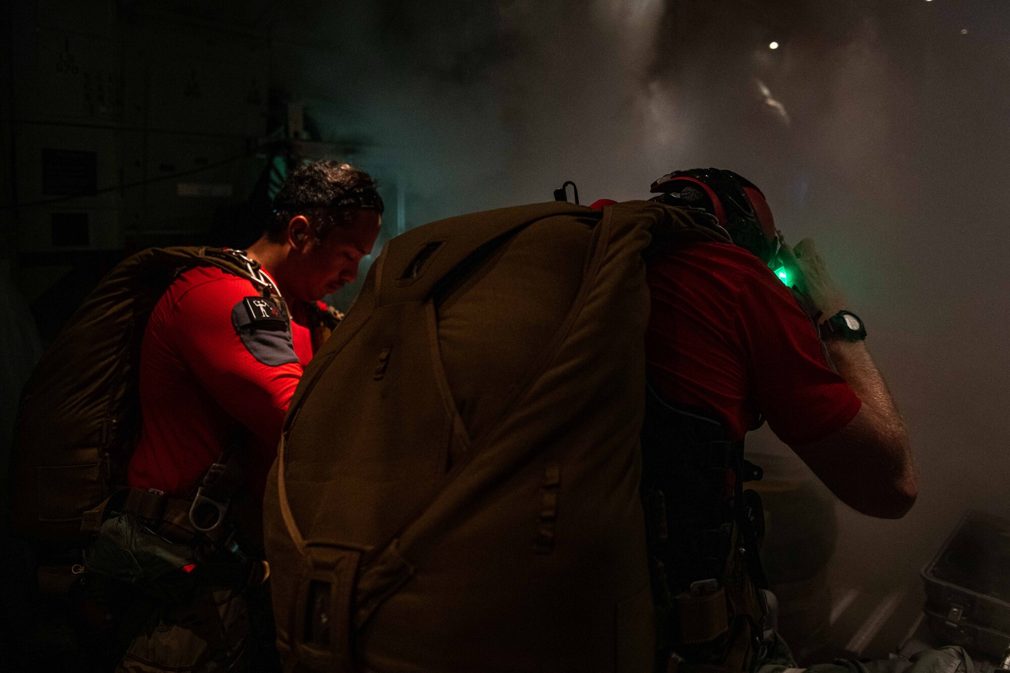 Two Airmen get ready for a jump over the ocean.