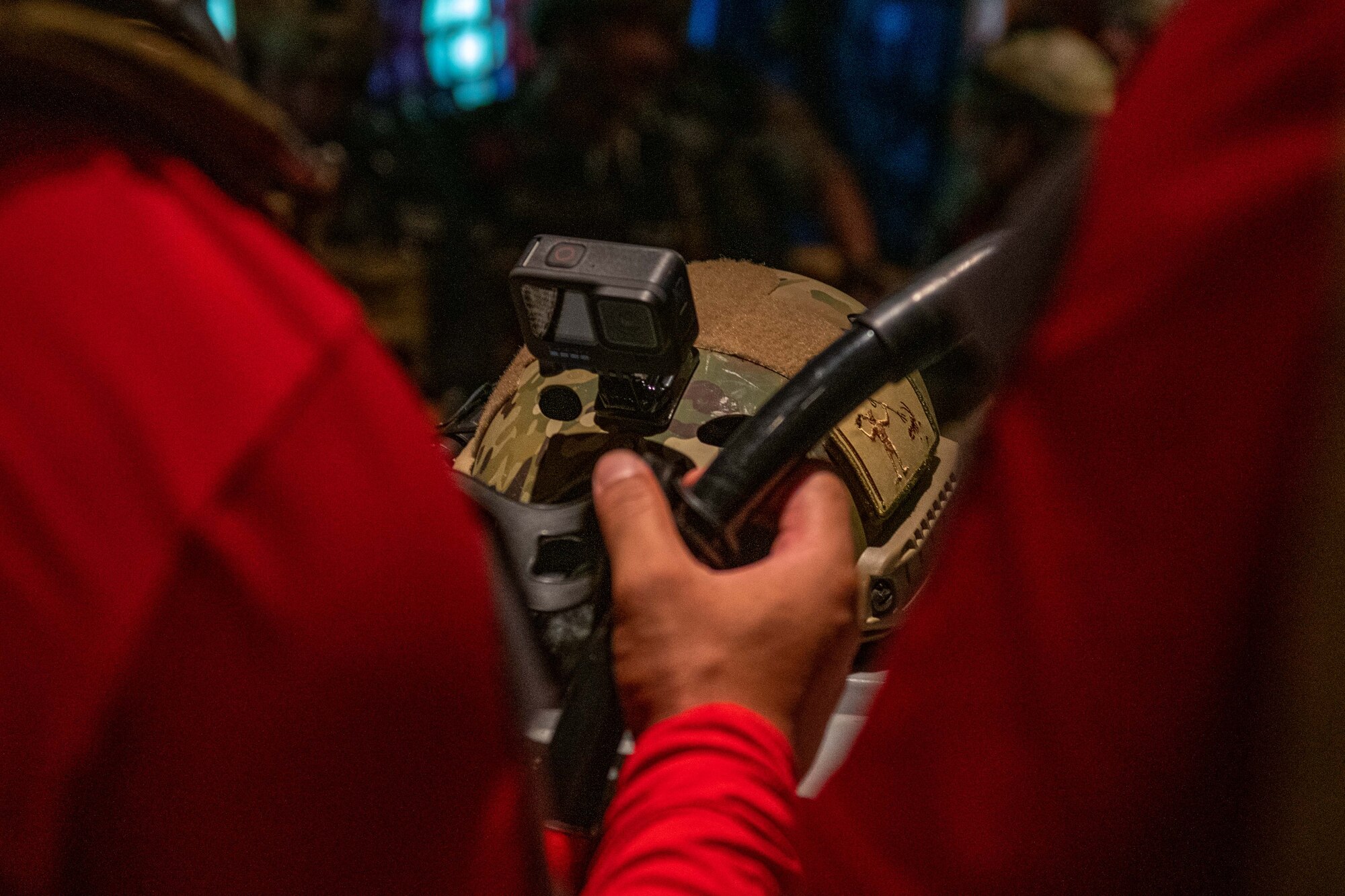 An Airman adjusts his goggles before getting everything on and ready for the jump.