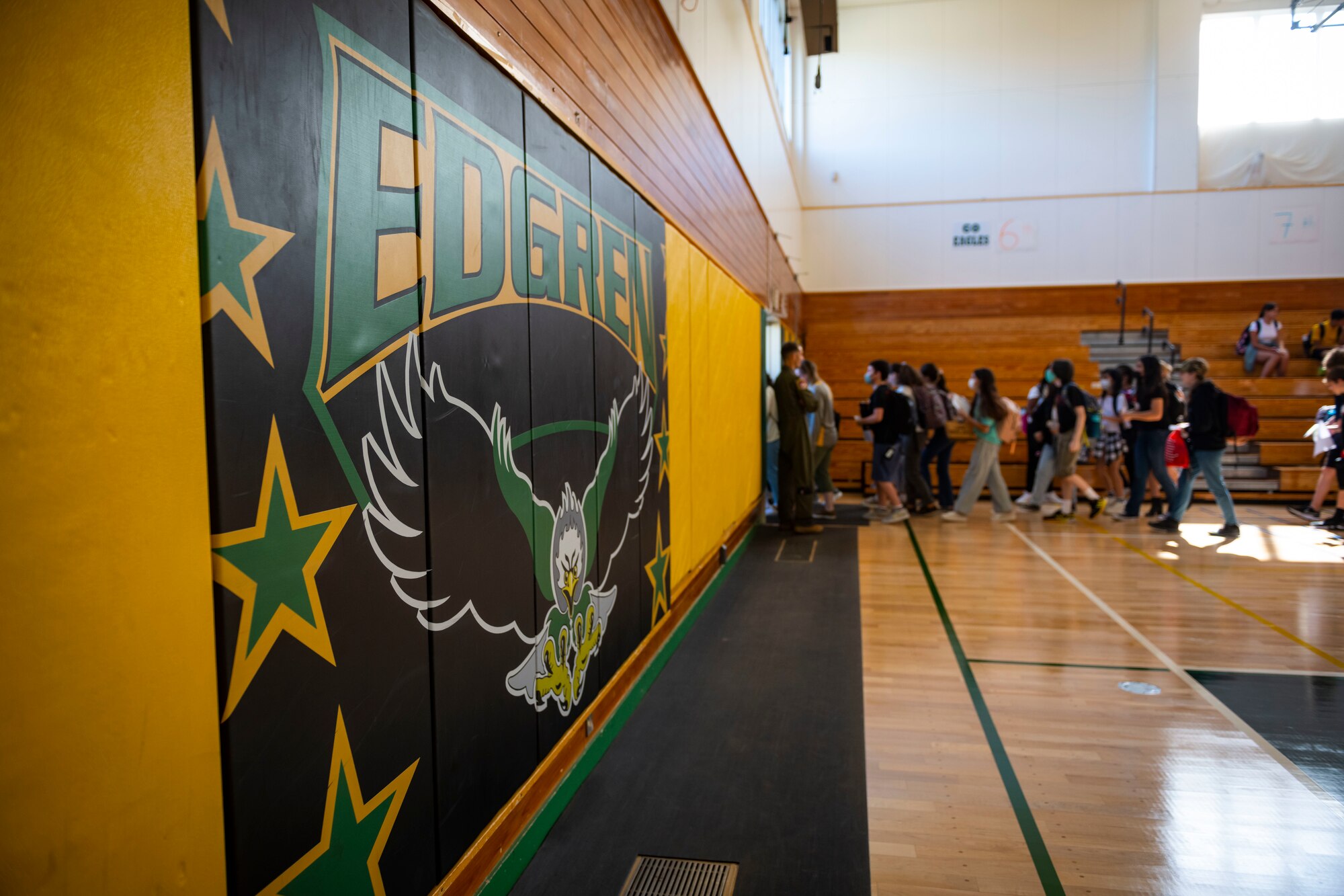 A sign titled Edgren with an eagle is displayed in a gym.