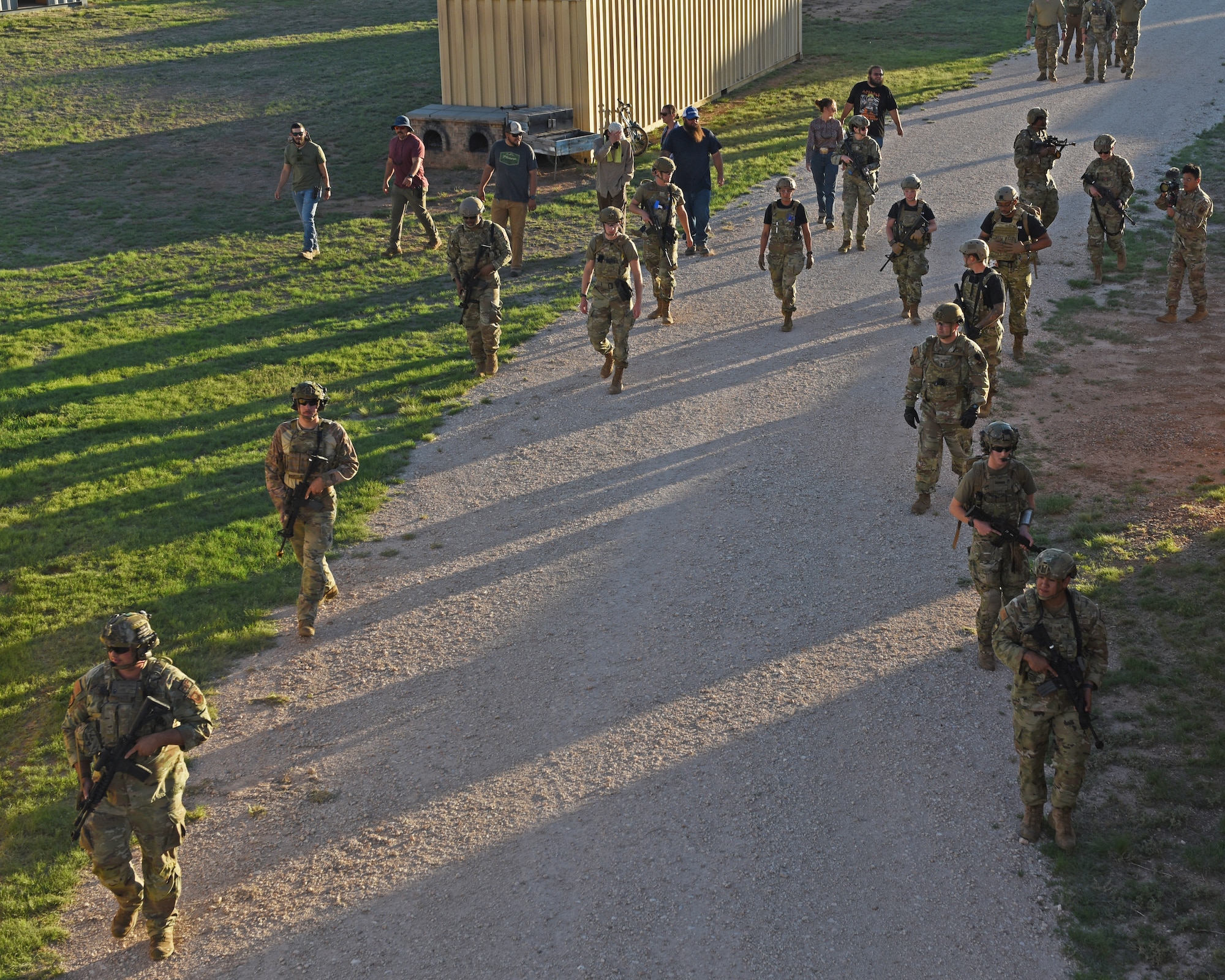 Medic teams enter Gotham City, a simulated village, during the 2022 Medic Rodeo, at Melrose Air Force Range, N.M. August 16, 2022. Airmen from around the world came to Cannon Air Force Base to participate in an annual training exercise. (U.S. Air Force photo by Airman 1st Class Zachary Heimbuch)