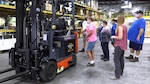 FRCE employees examine forklift