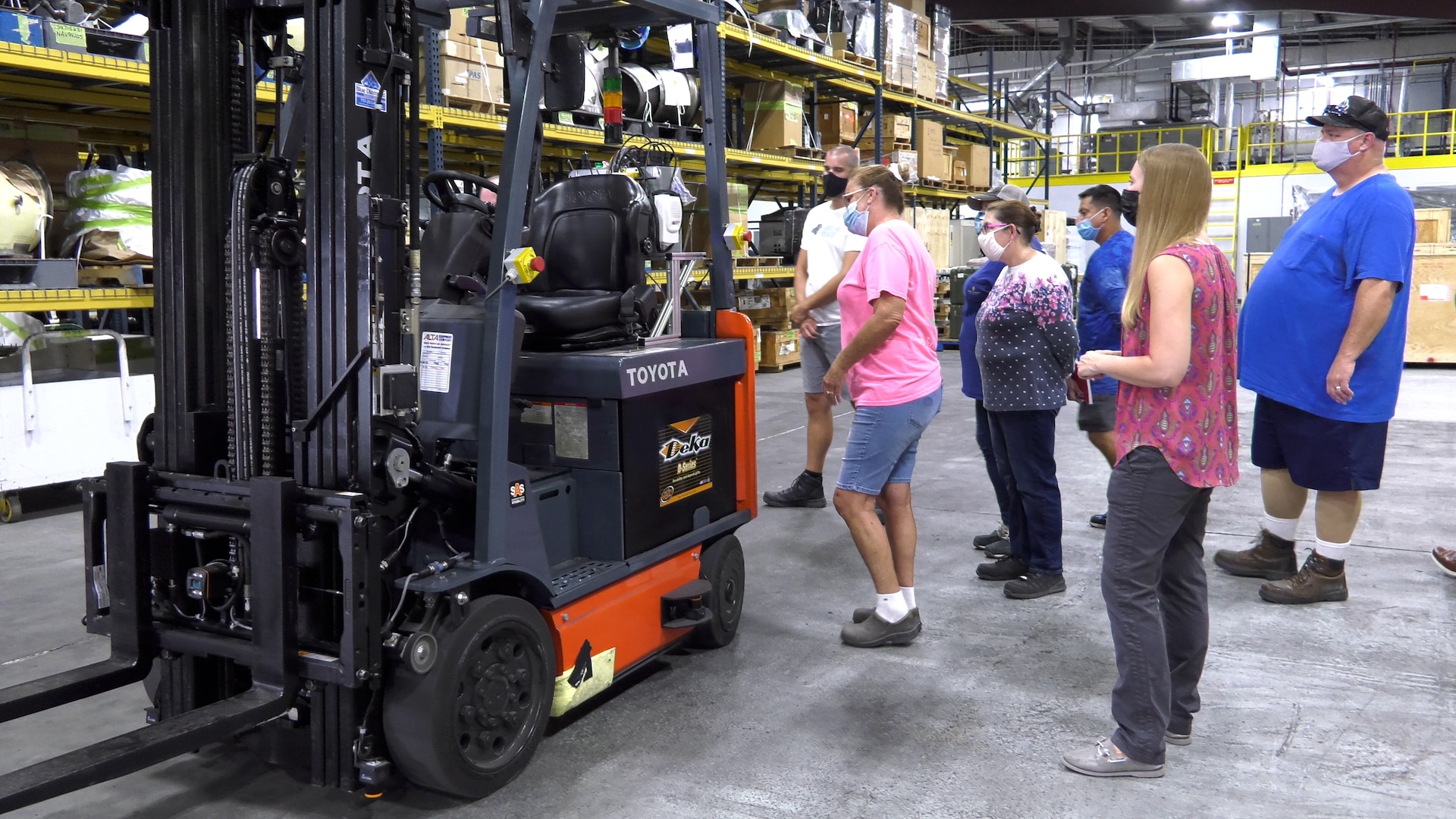 FRCE employees examine forklift